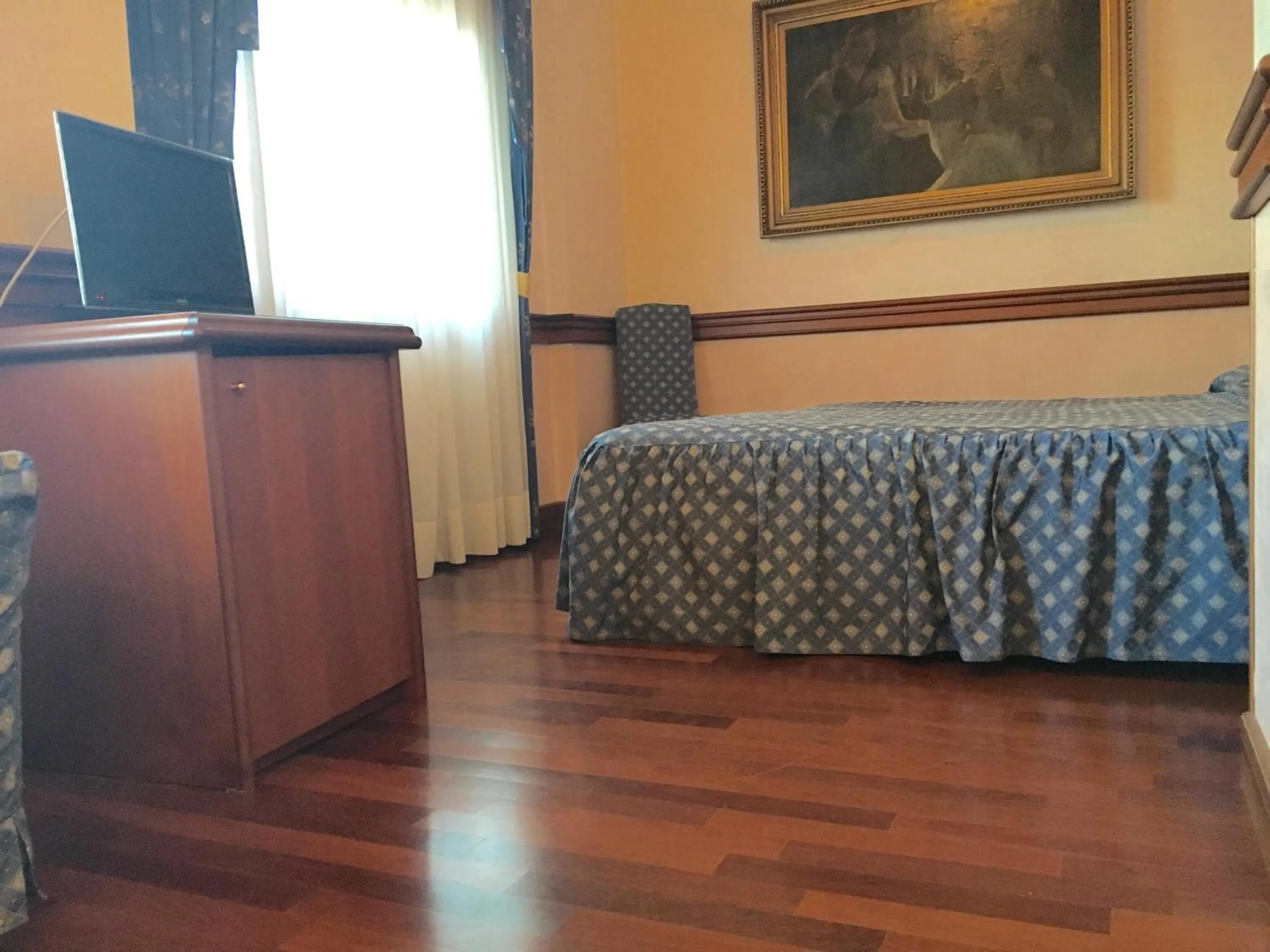 Living room, Bed in Hotel Minerva