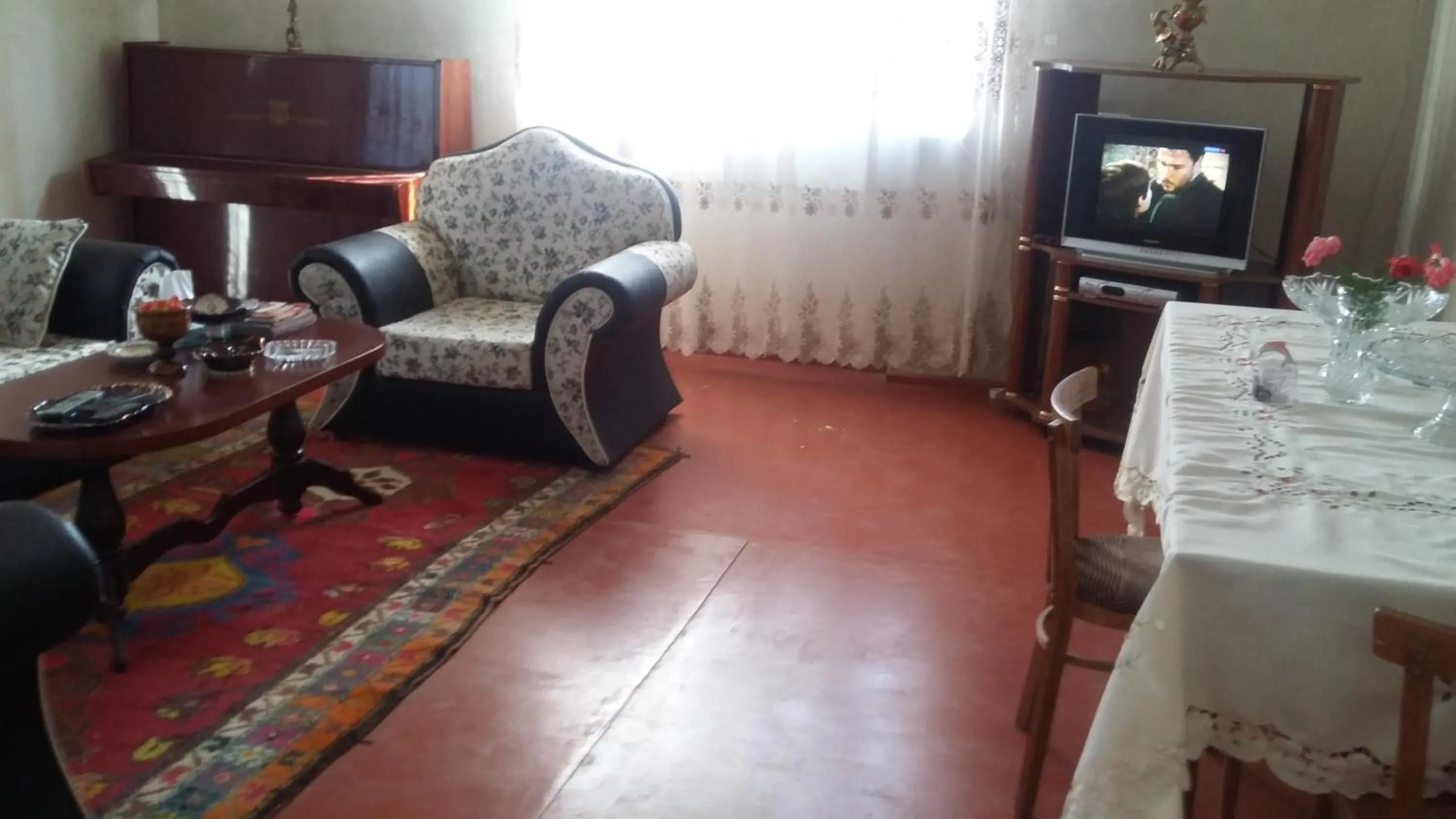 Communal lounge/ TV room in Shushan GUEST HOUSE