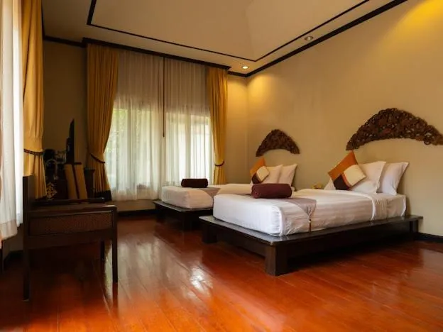Bed in Kanok Buri Resort