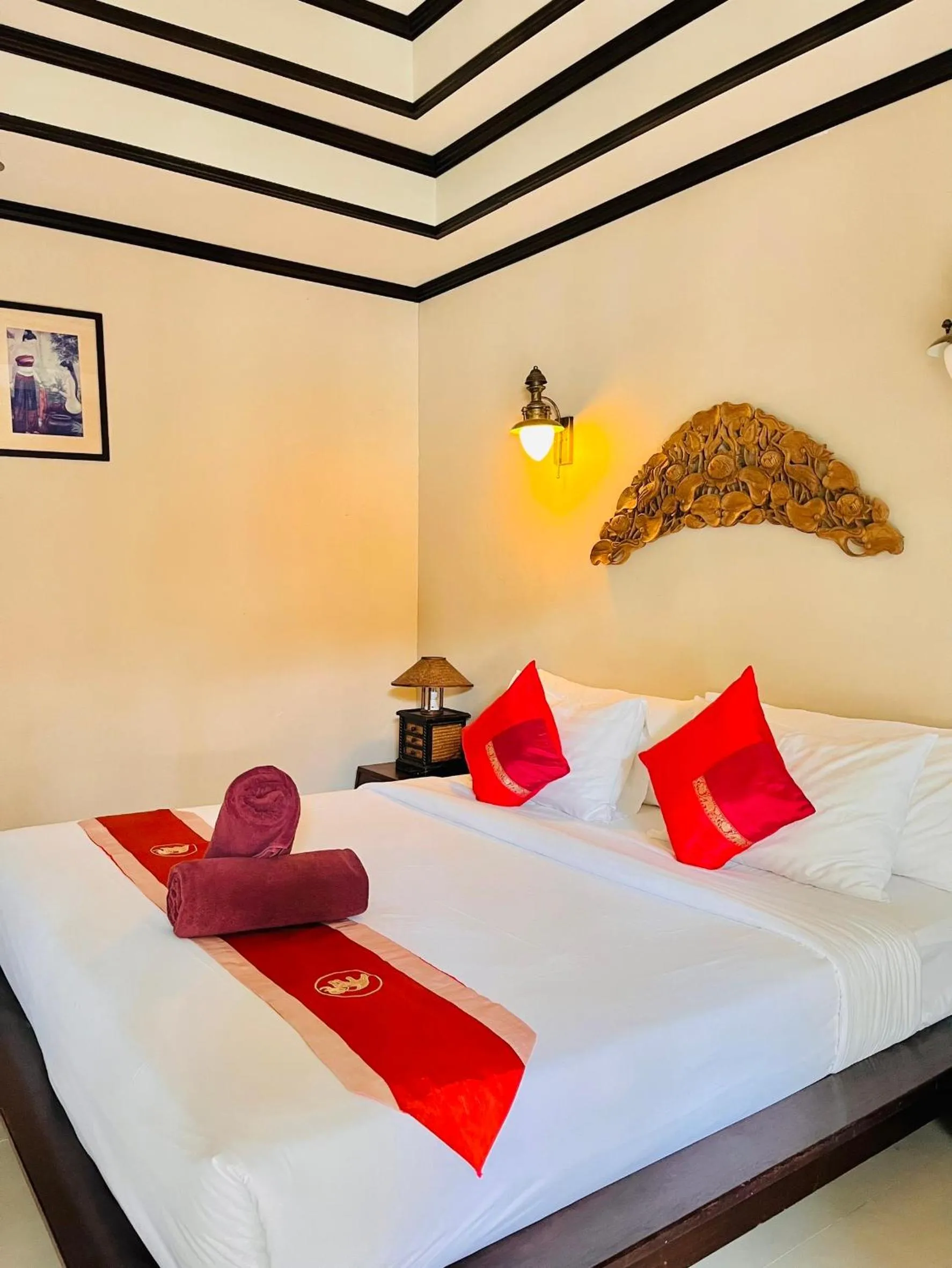 Bed in Kanok Buri Resort