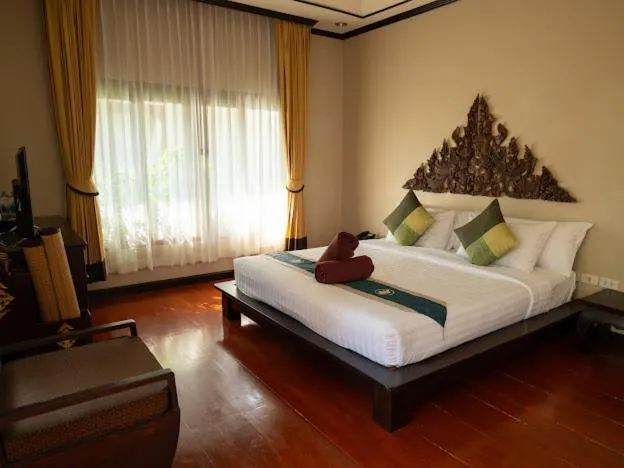 Bed in Kanok Buri Resort