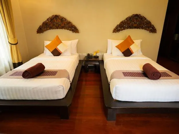 Bed in Kanok Buri Resort
