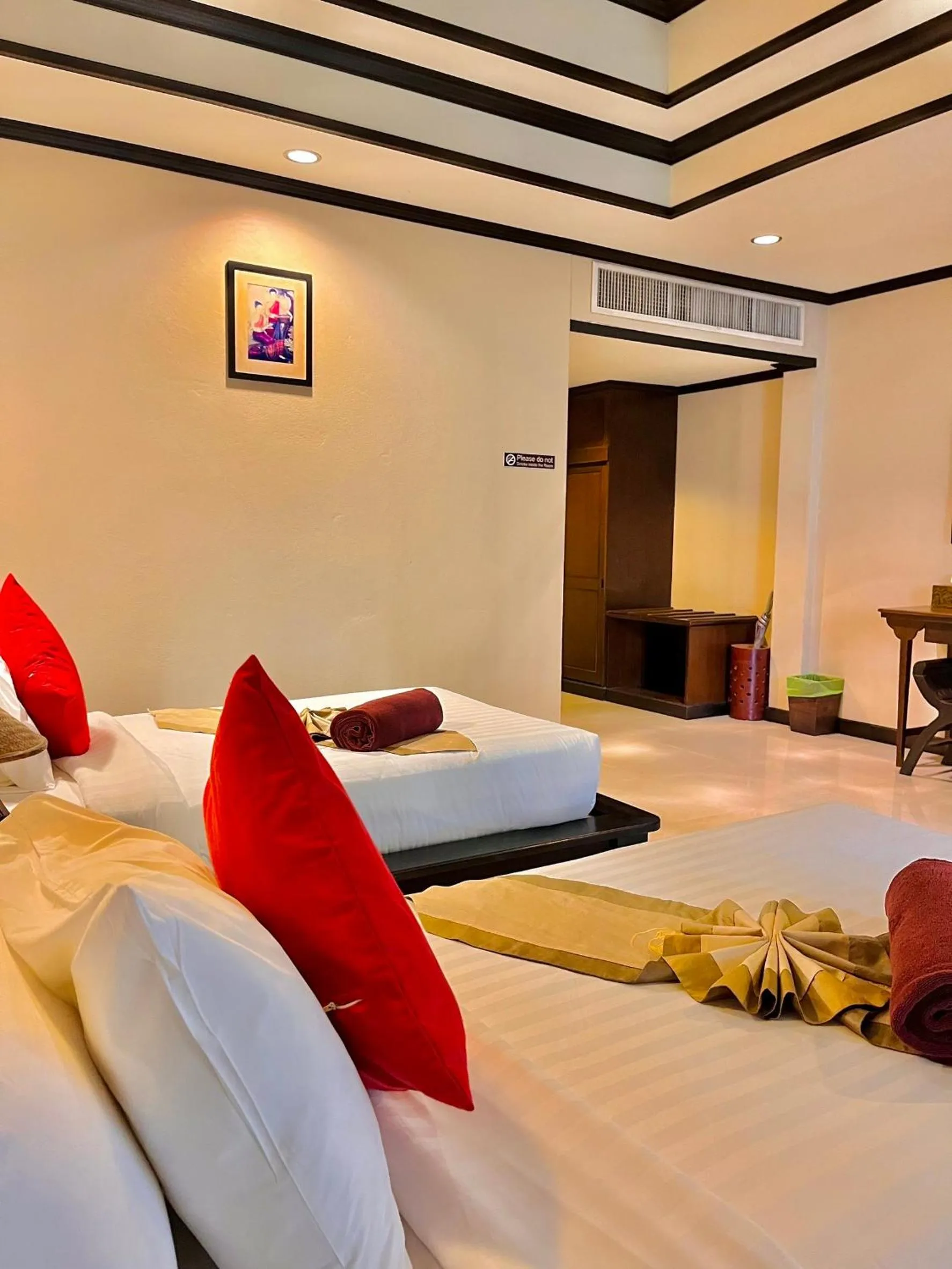 Bed in Kanok Buri Resort