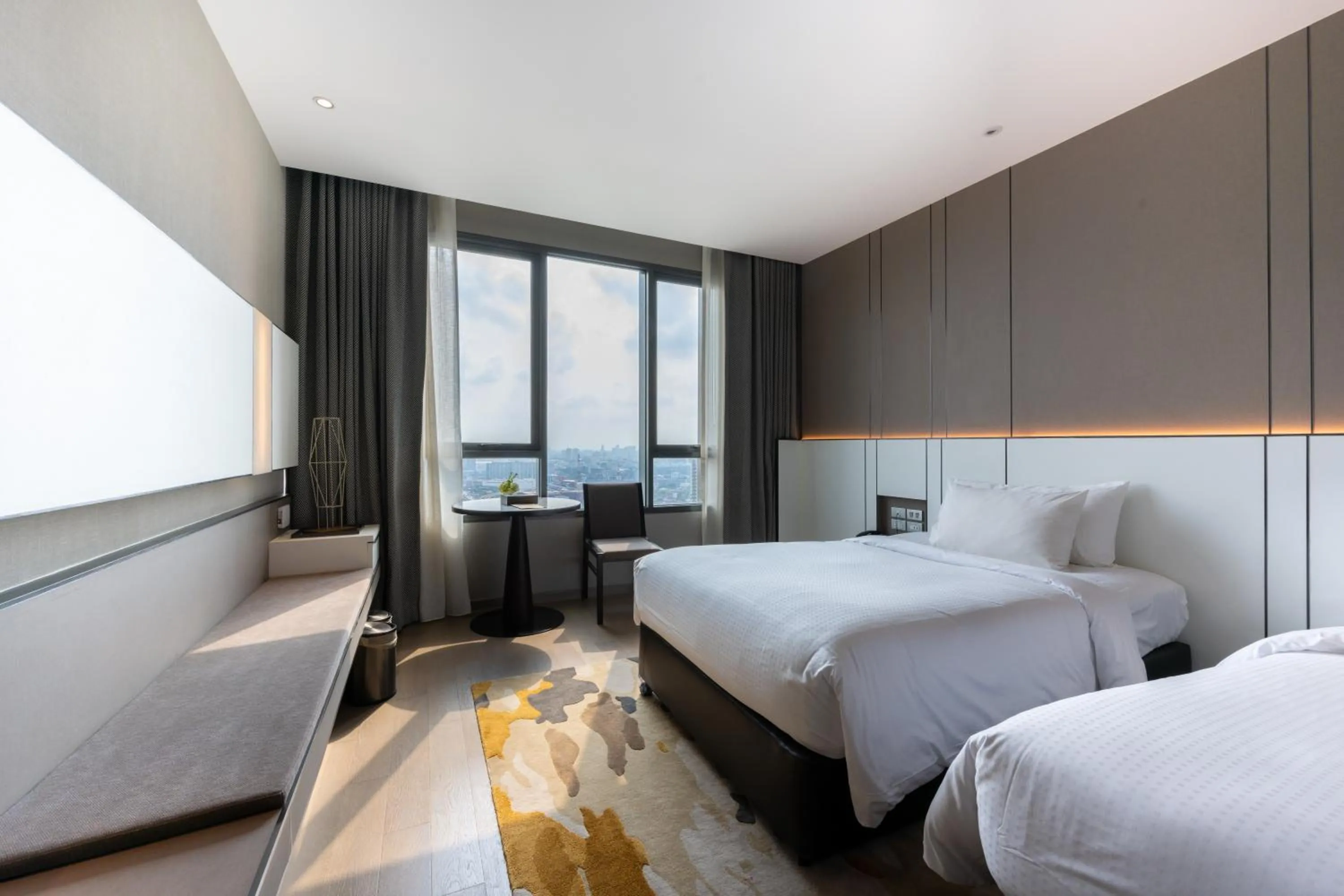 Bed in Grand Richmond Stylish Convention Hotel