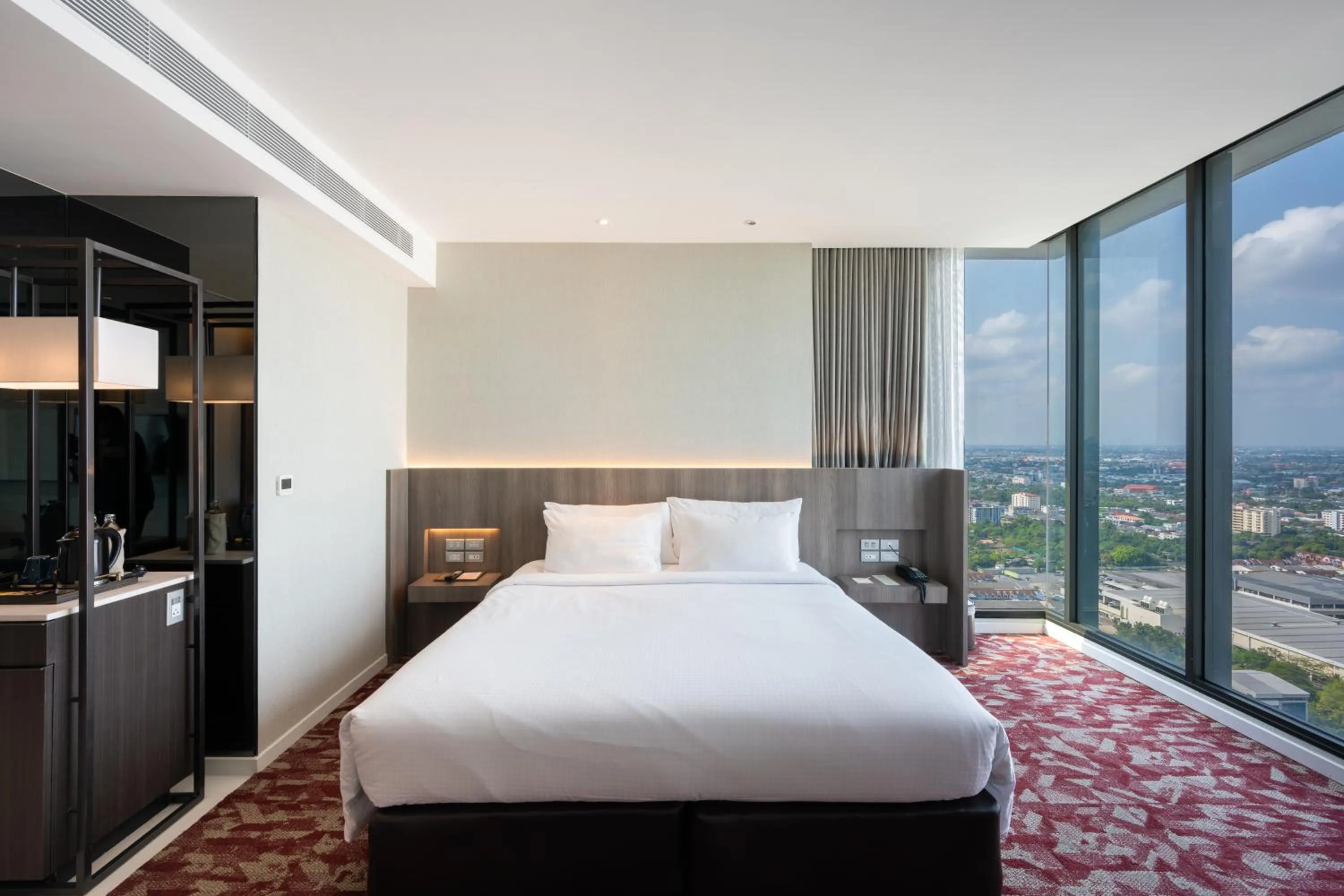 Bed in Grand Richmond Stylish Convention Hotel