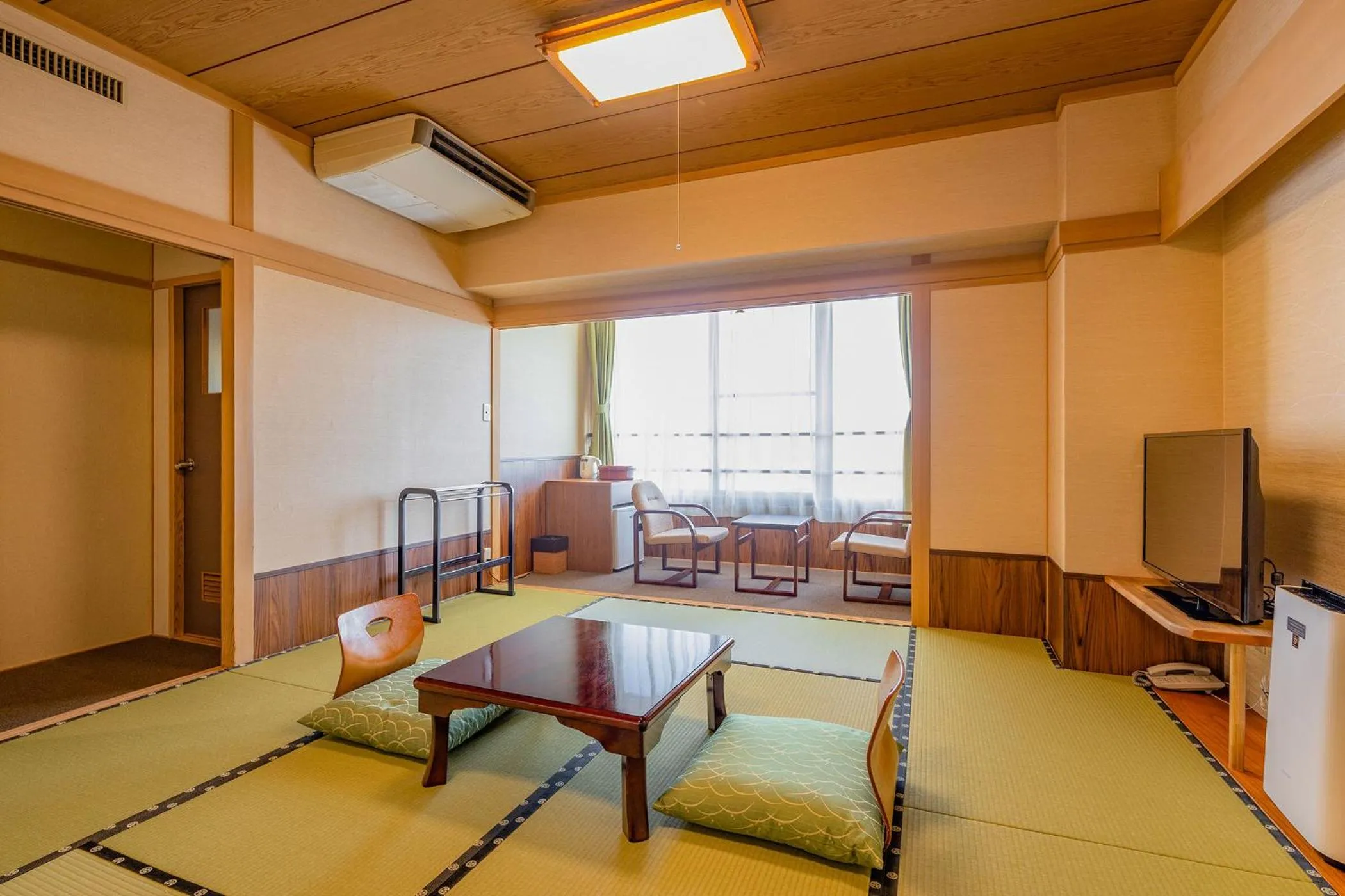 Bed in Ooedo Onsen Monogatari Amakusa Hotel Kameya
