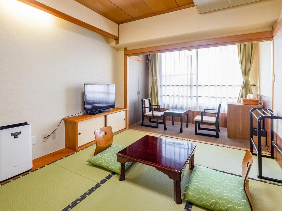 Bed in Ooedo Onsen Monogatari Amakusa Hotel Kameya