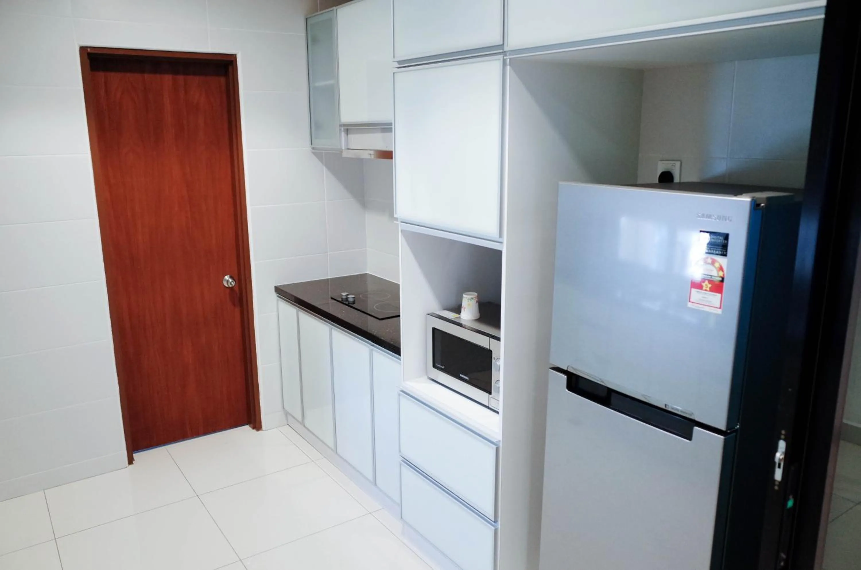 Kitchen or kitchenette in Holiday Homes At Samsuria Resort