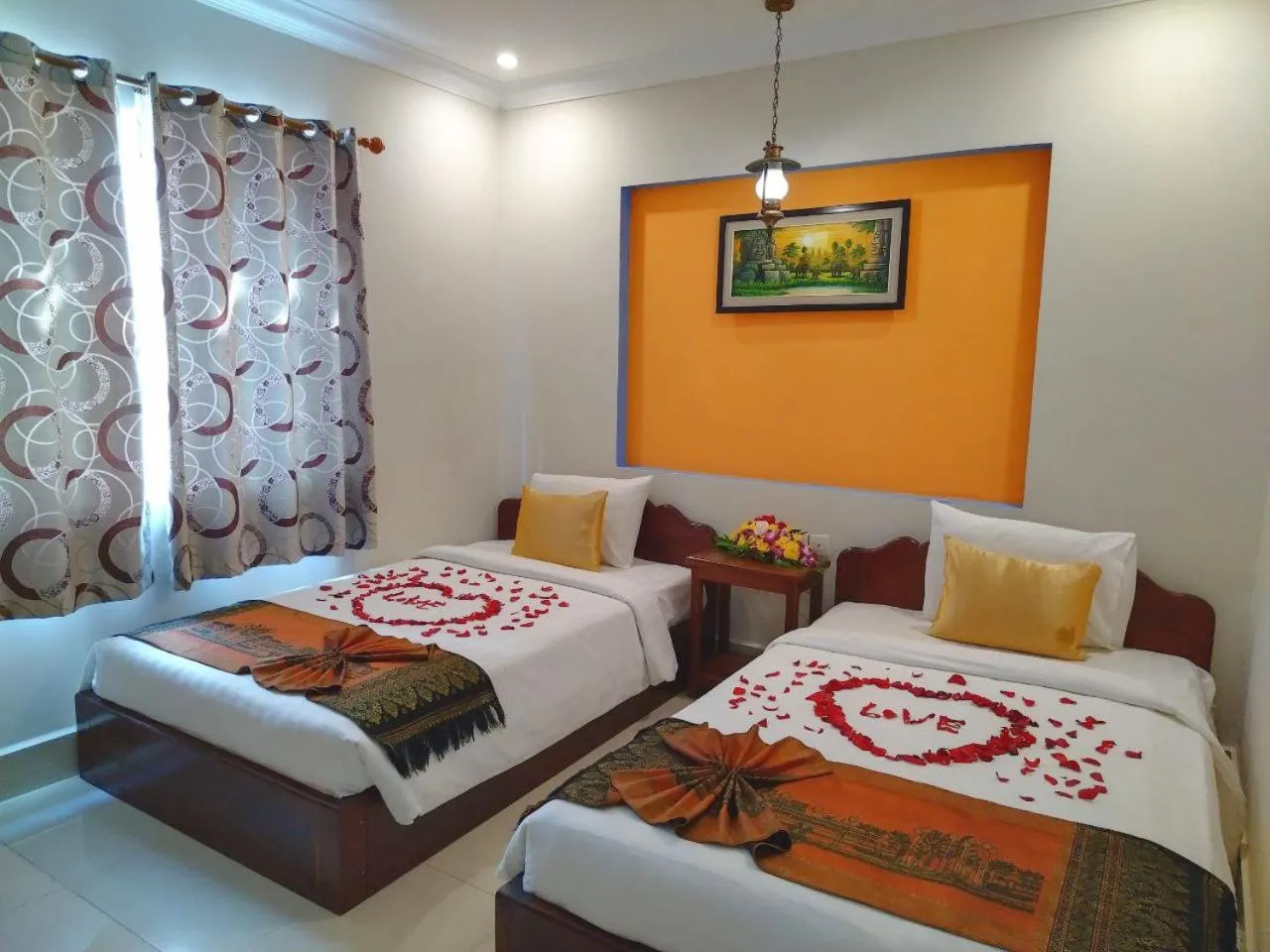 Bed in Plumeria Hotel & Spa