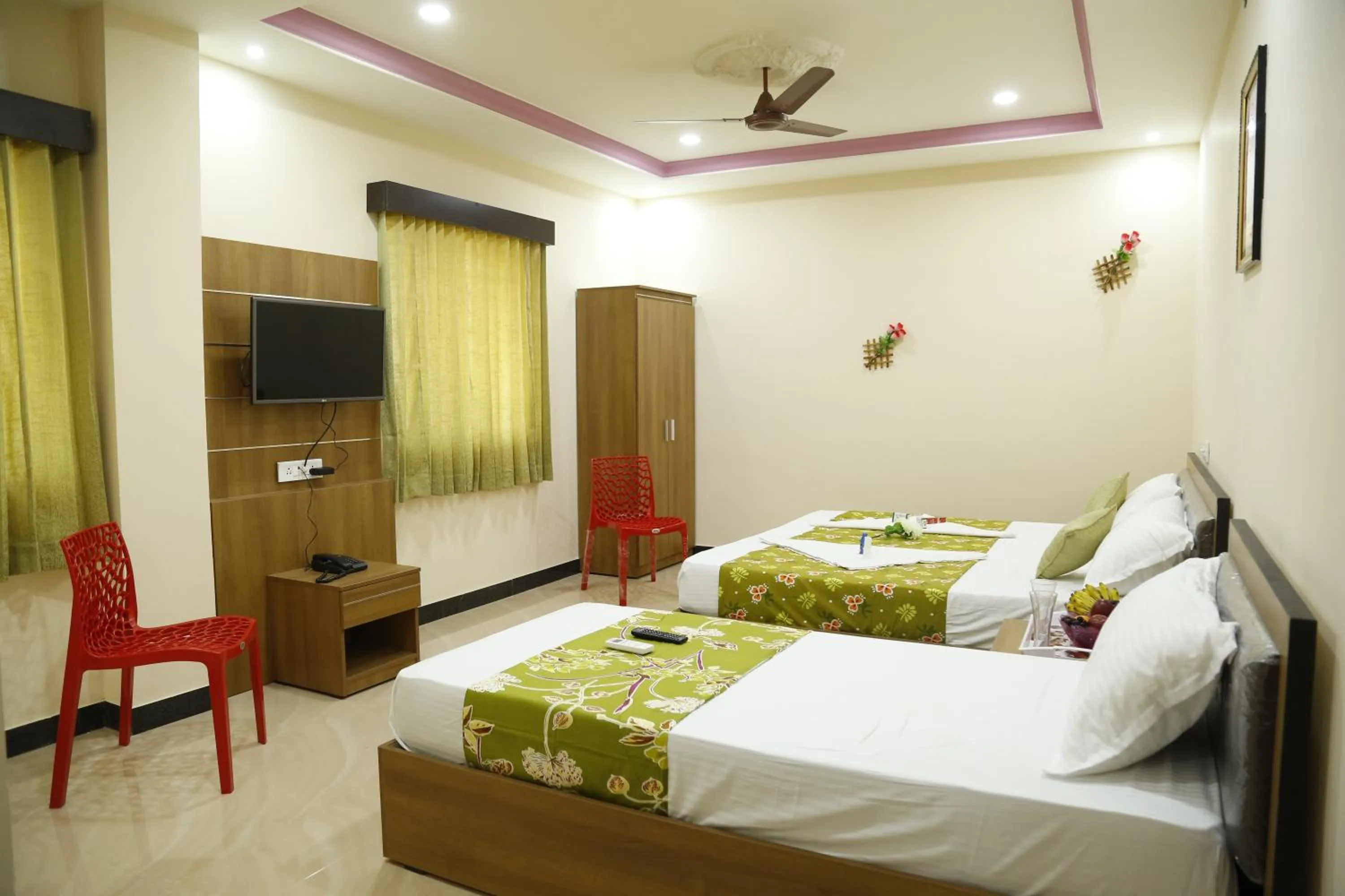 Bedroom in Hotel New Amirtham inn