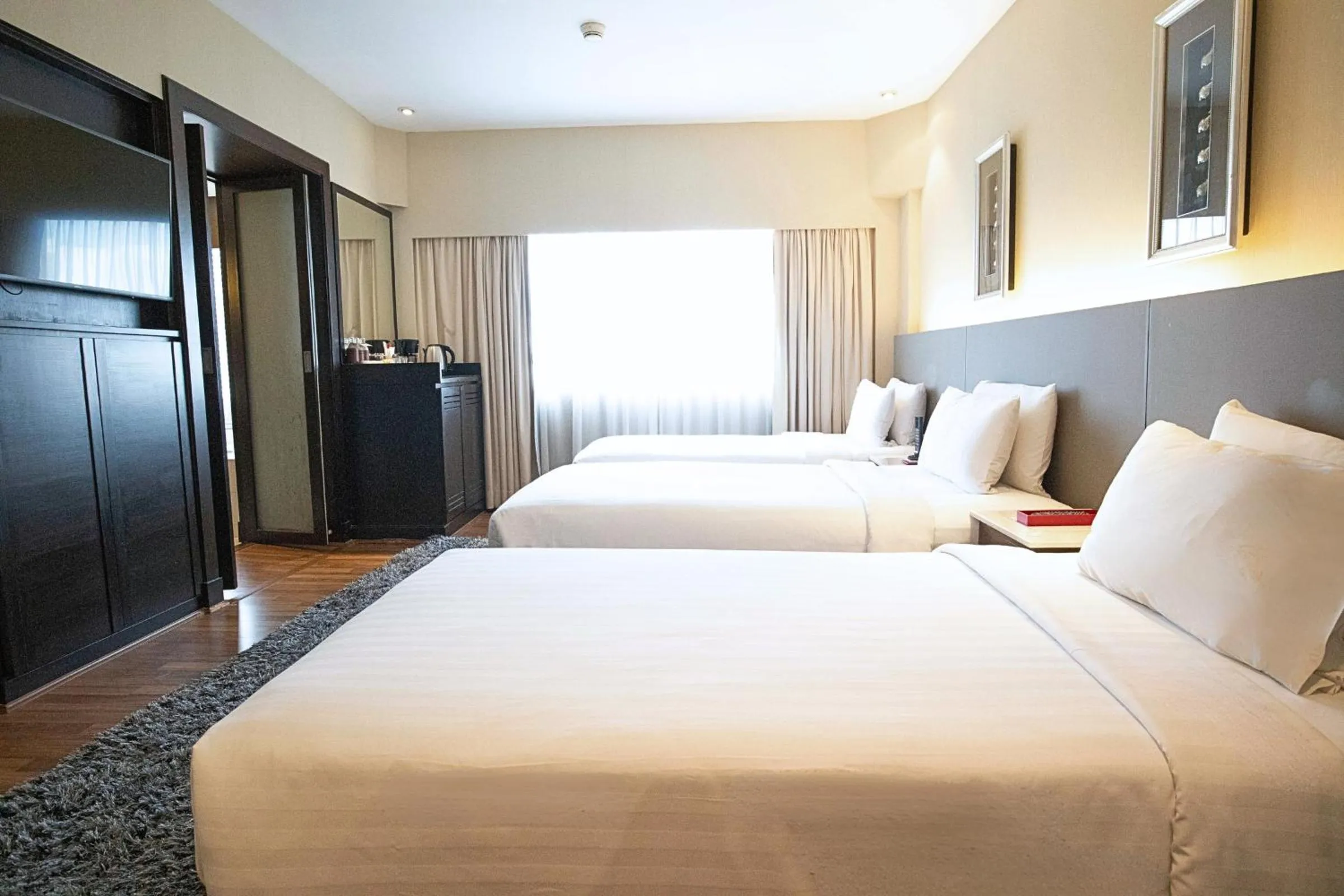 Bed in Ramada Plaza by Wyndham Bangkok Menam Riverside