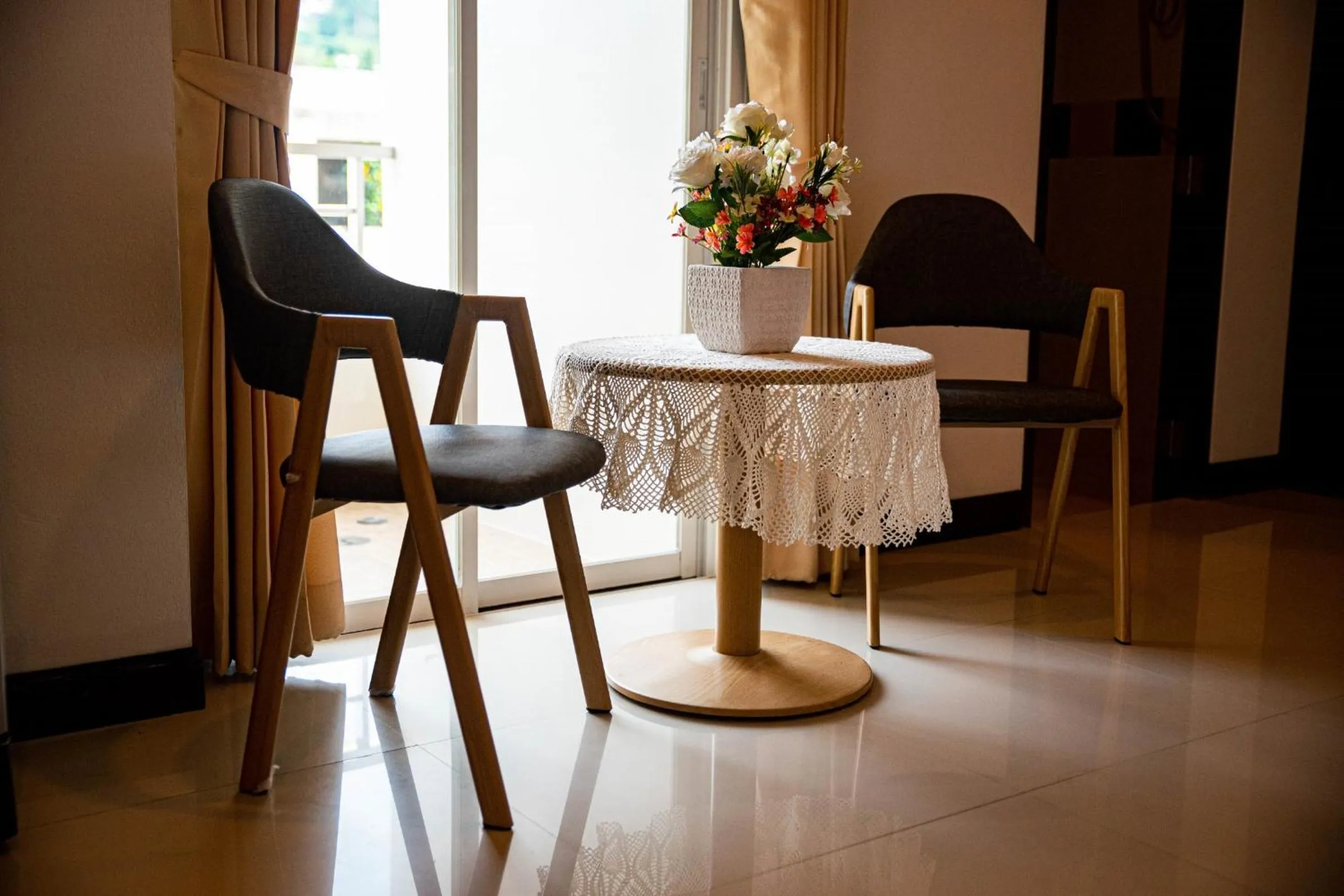 Seating area in Q Victory Patong Hotel