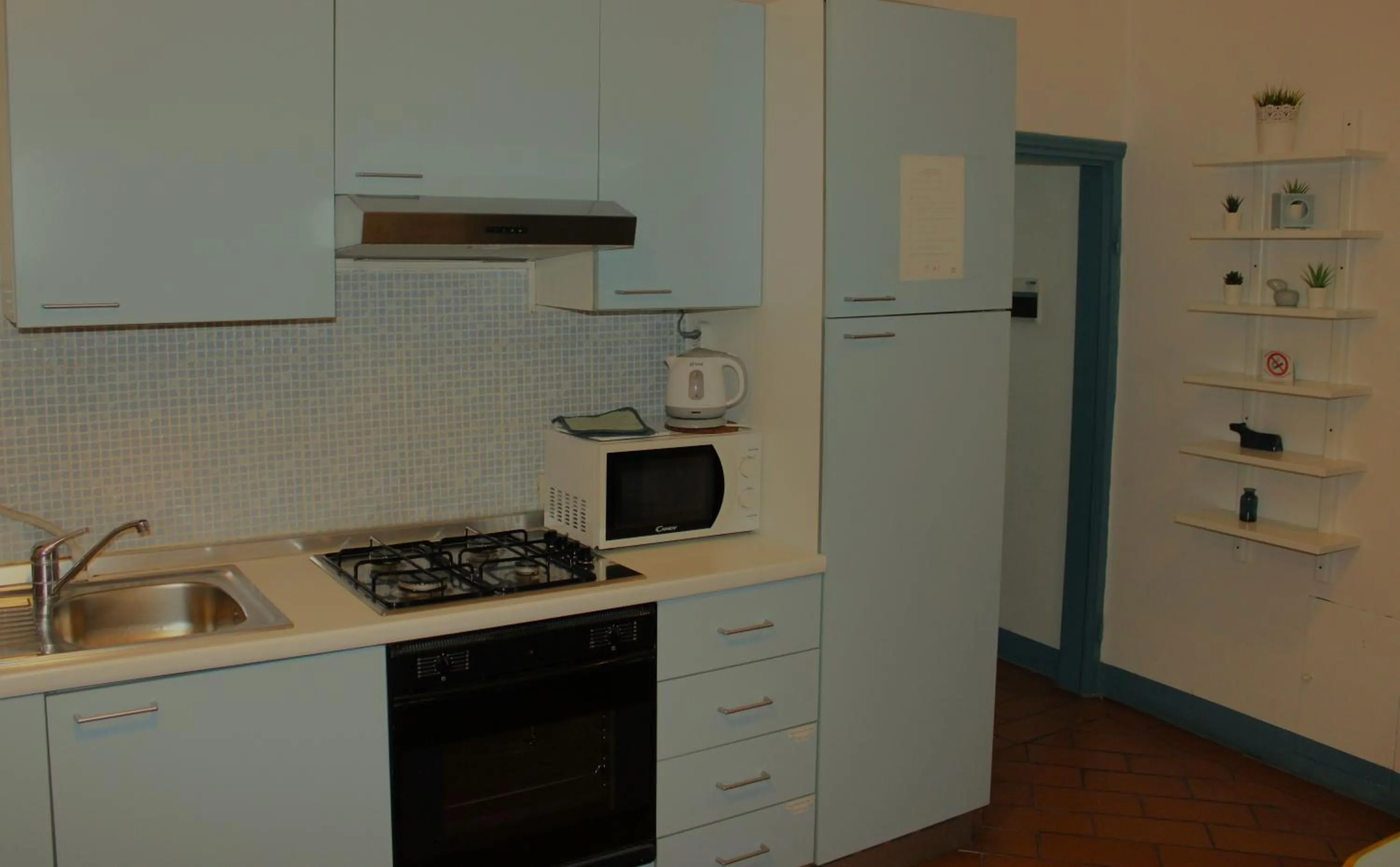 Kitchen or kitchenette in Michelangelo's Relais