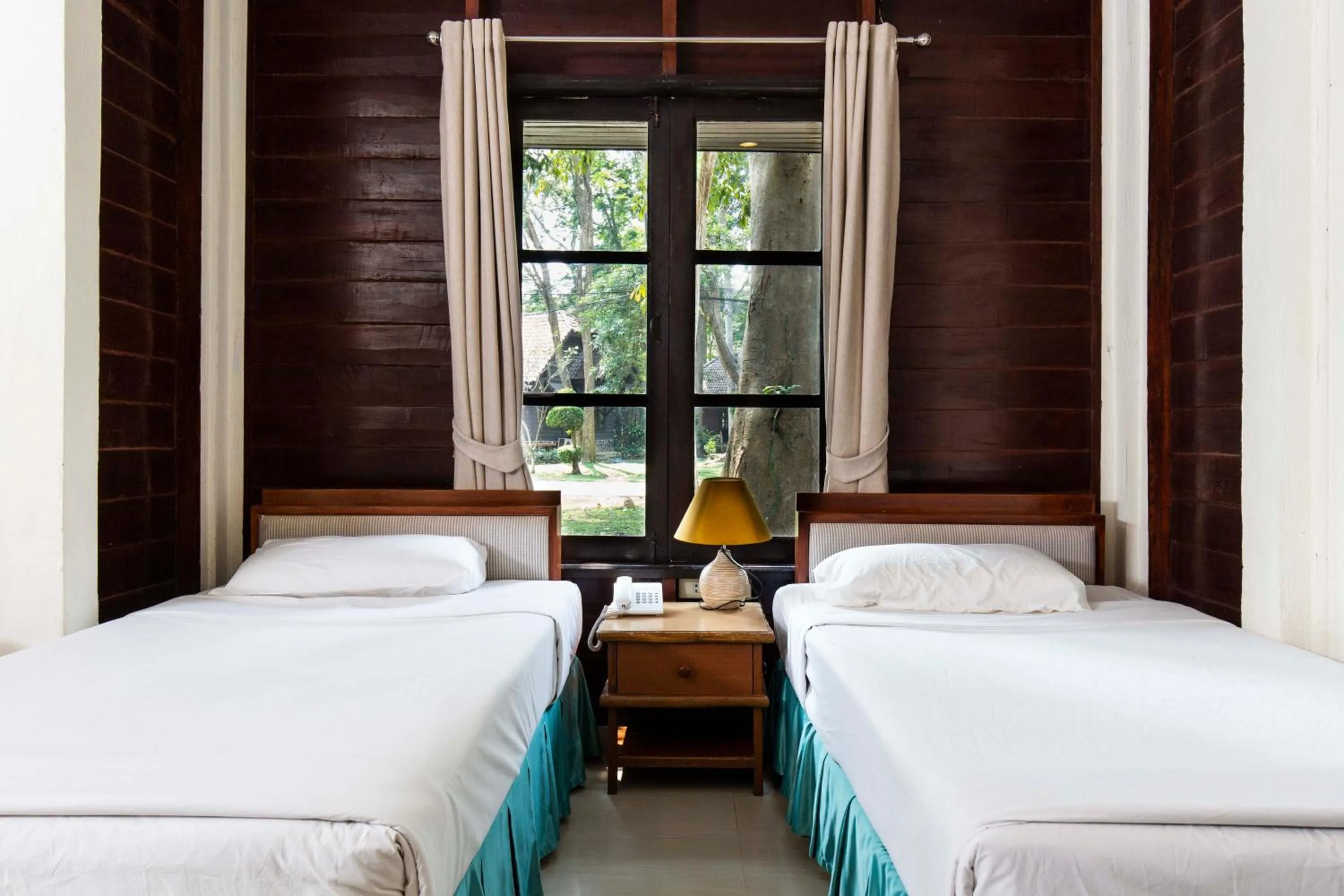 Bed in The Legacy River Kwai Resort