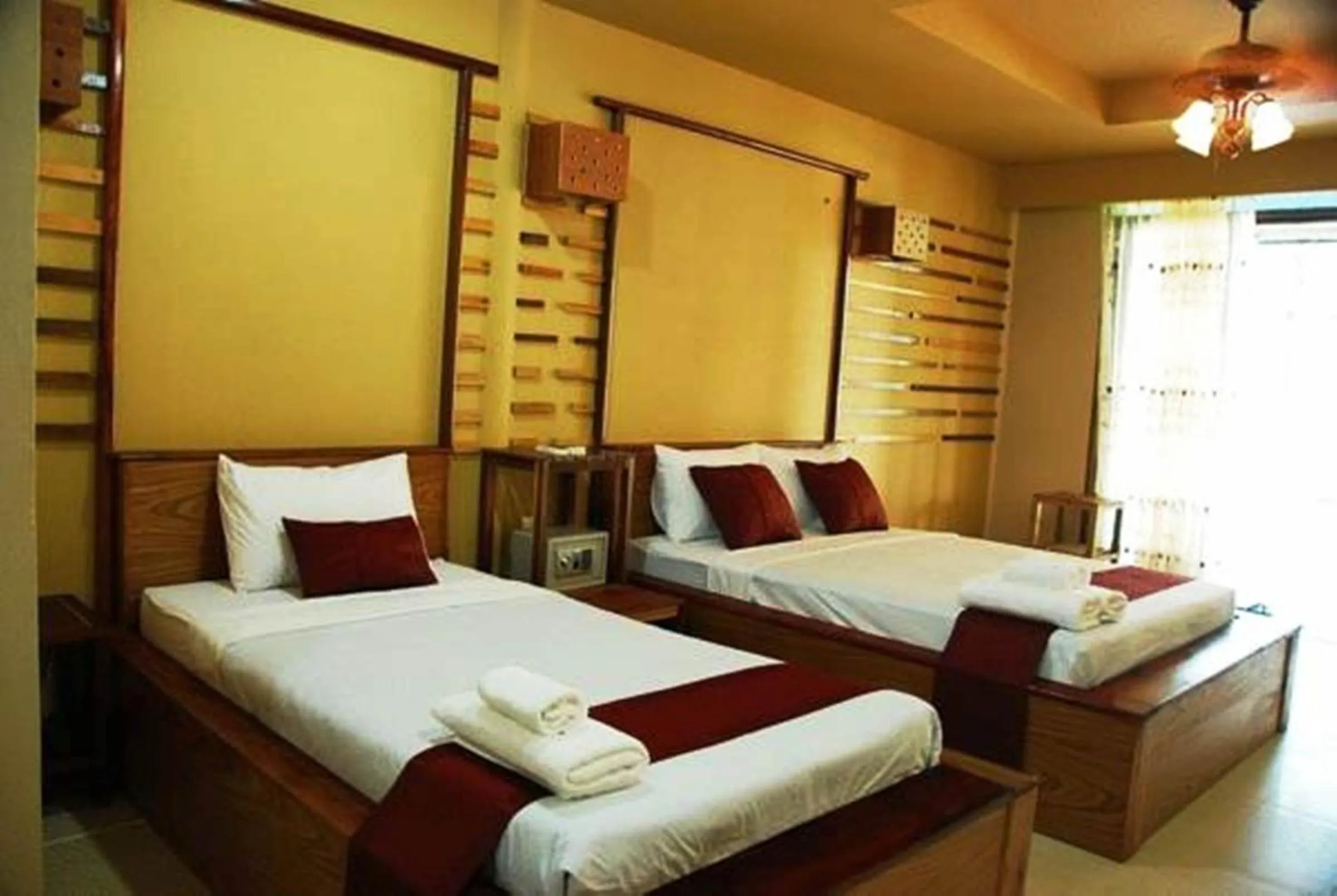 Bed in Boutique Raft Resort, River Kwai