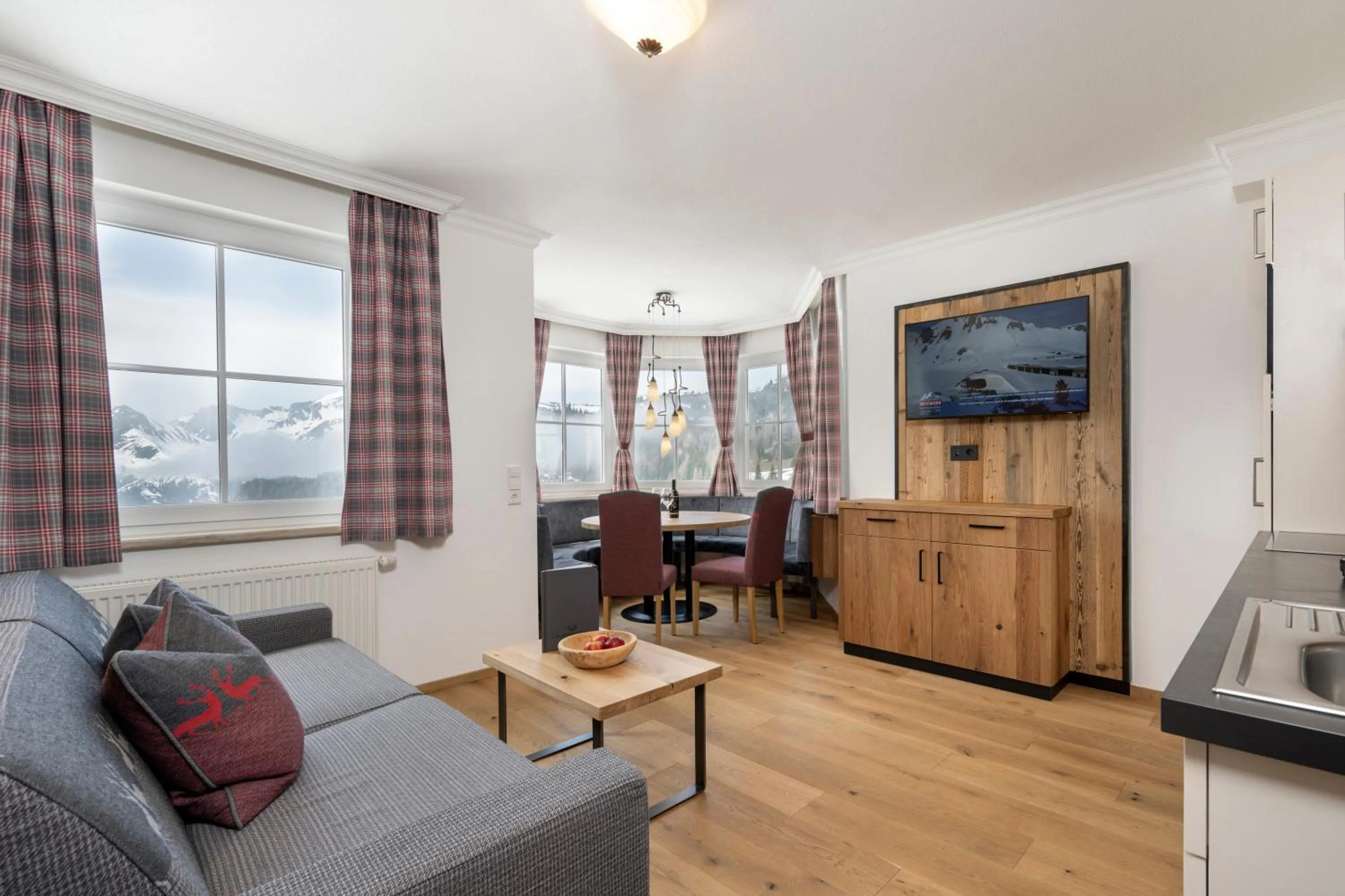 Communal lounge/ TV room in Hotel Almschlössl & Schrotteralm