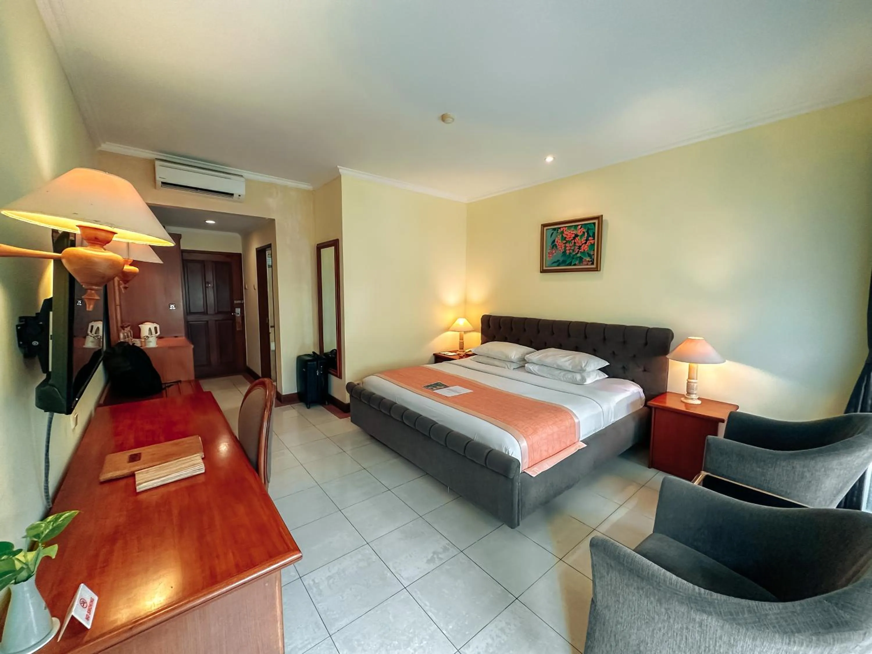 Bed in Parigata Resorts and Spa