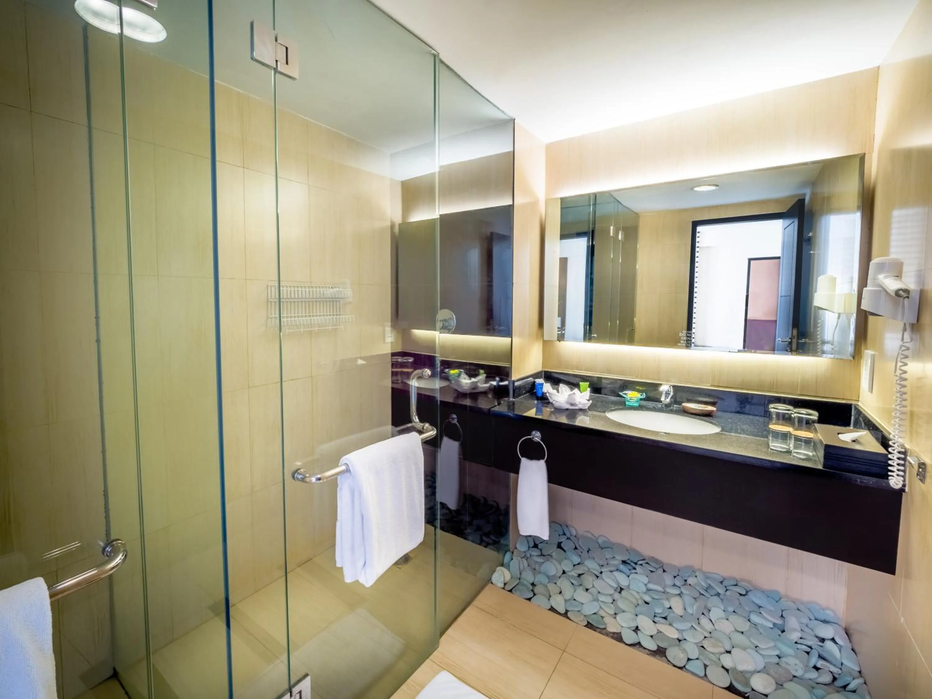 Bathroom in Aston Kuta Hotel and Residence