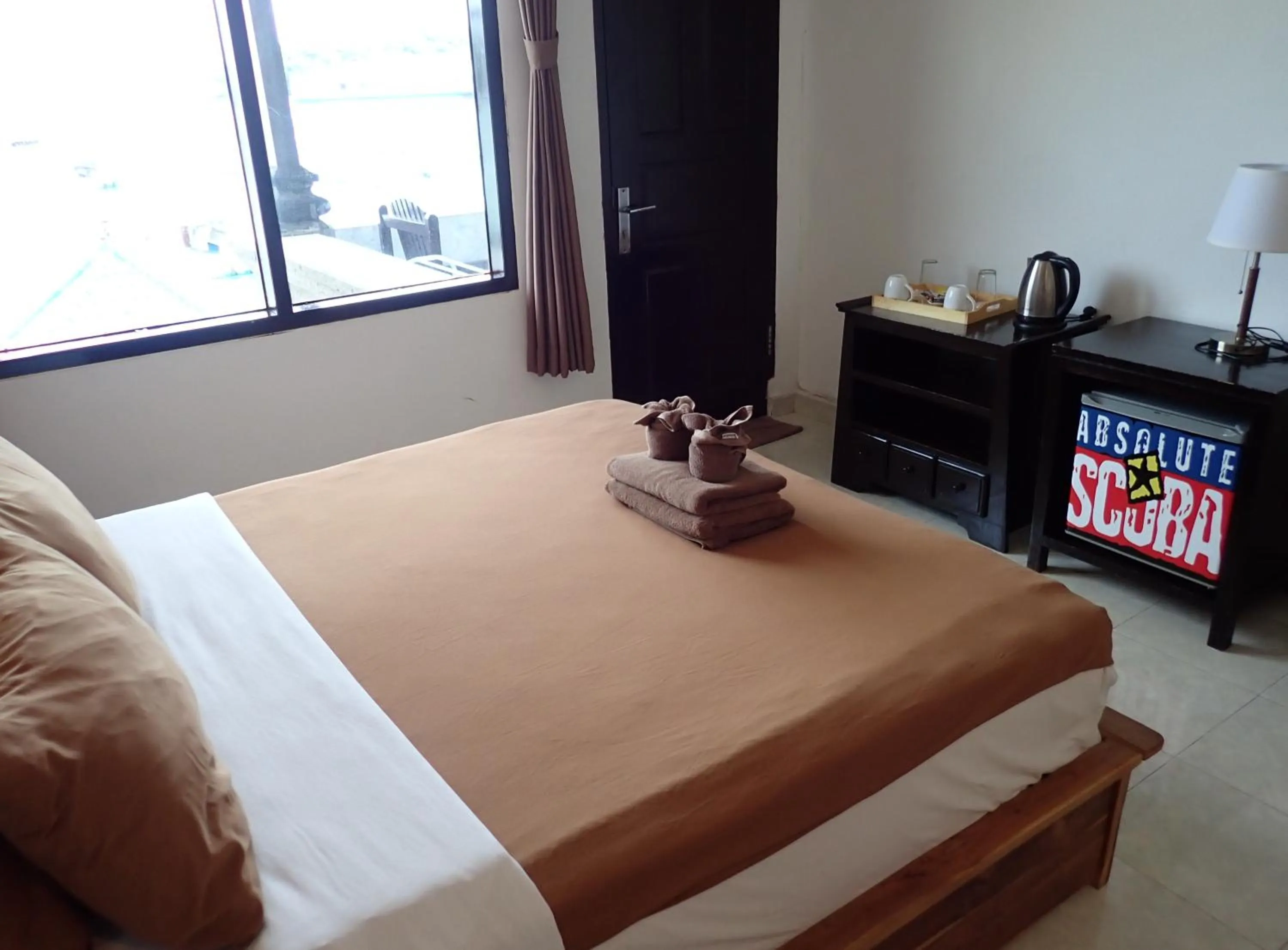 Bed in Absolute Scuba Bali Dive Resort