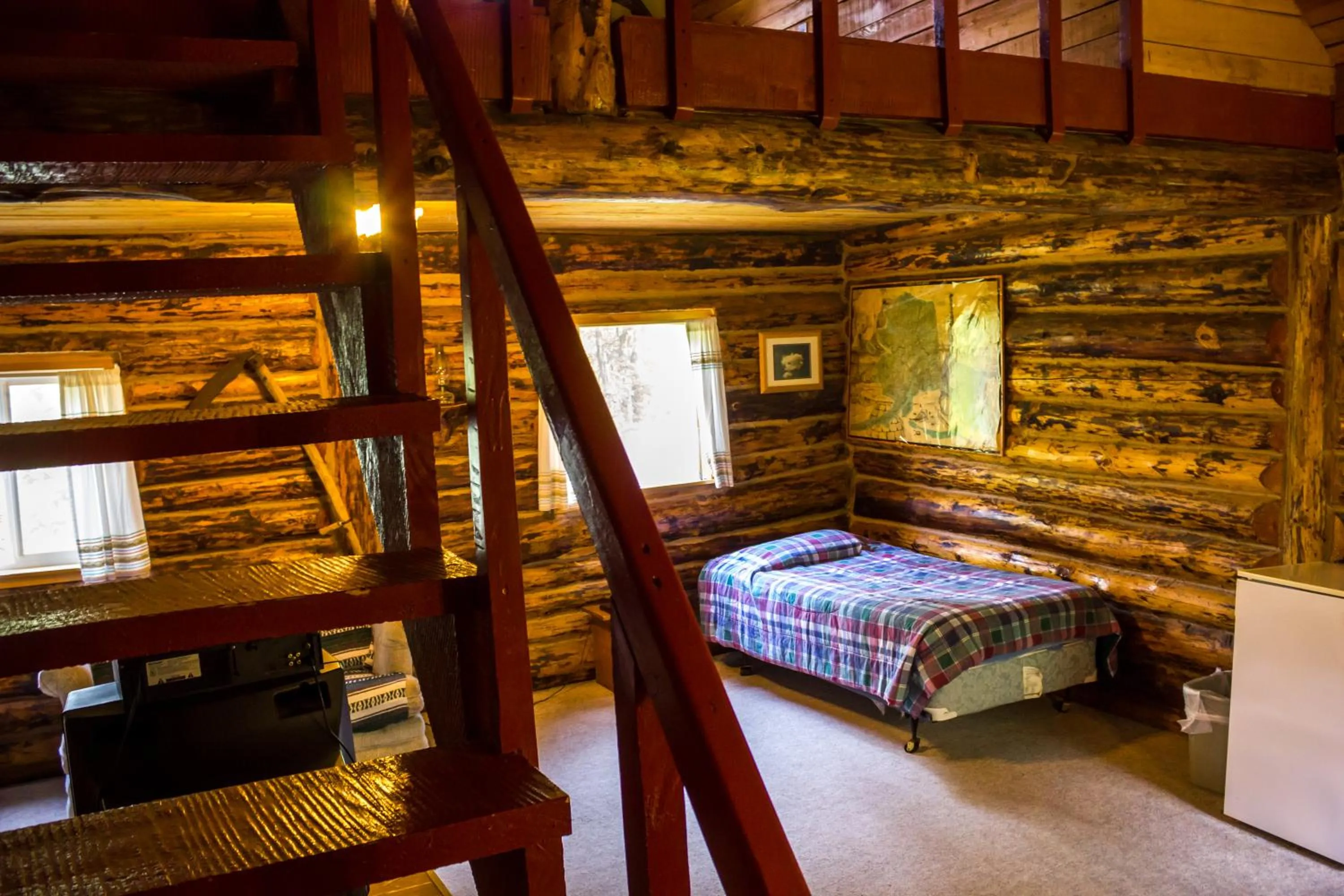 Bed in Midnight Sun Log Cabins