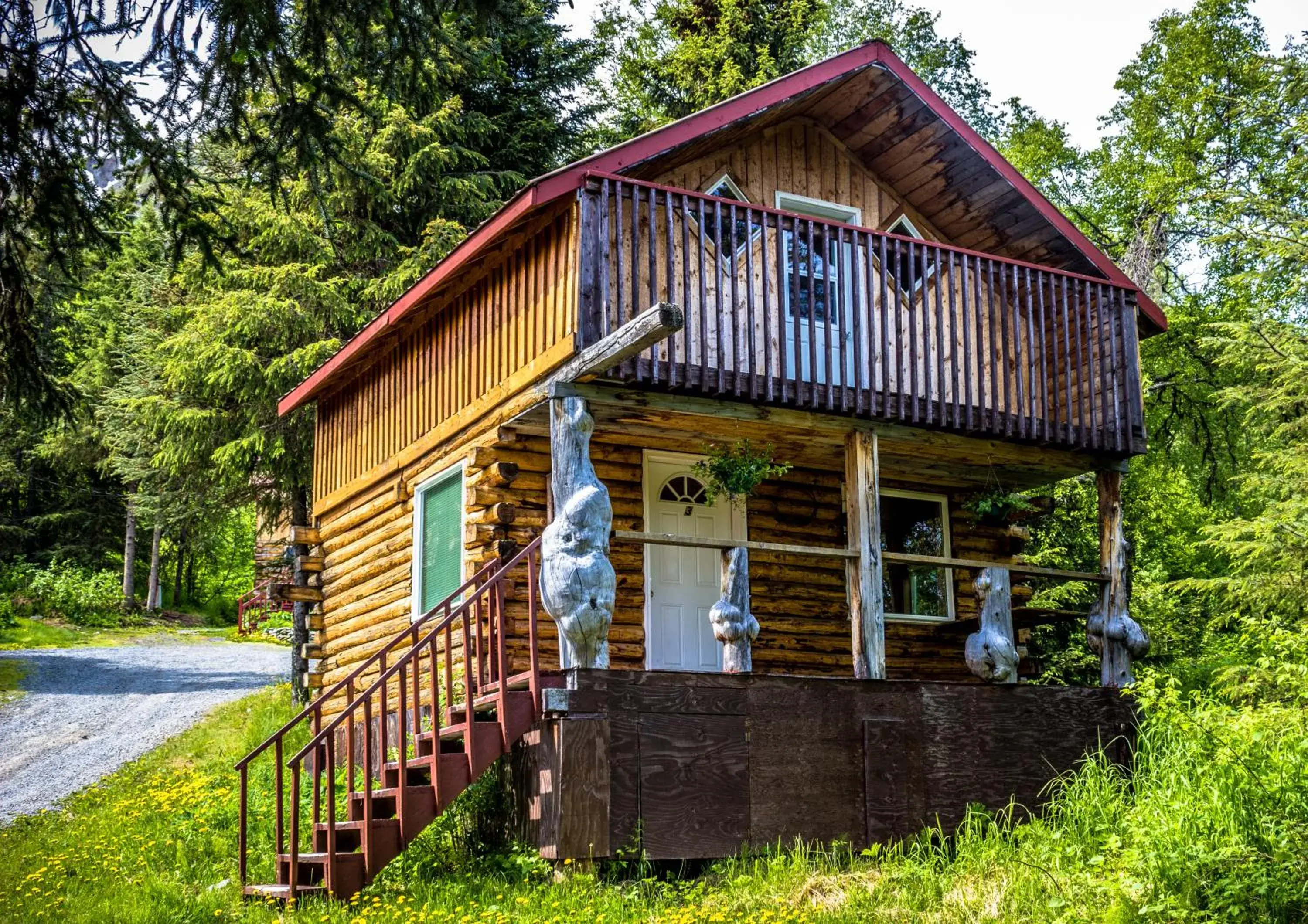 Family Room with Balcony in Midnight Sun Log Cabins Family Room with Balcony in Midnight Sun Log Cabins
