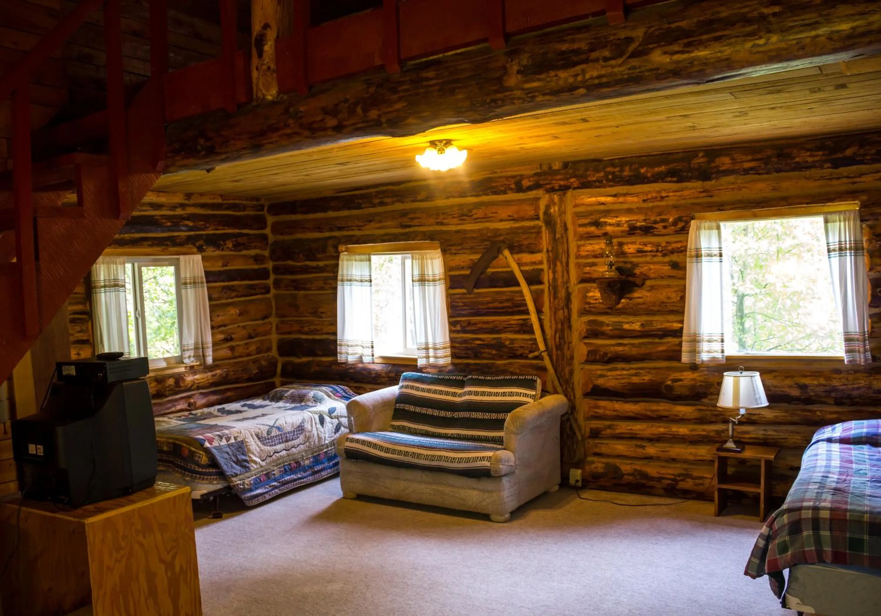 Bed in Midnight Sun Log Cabins