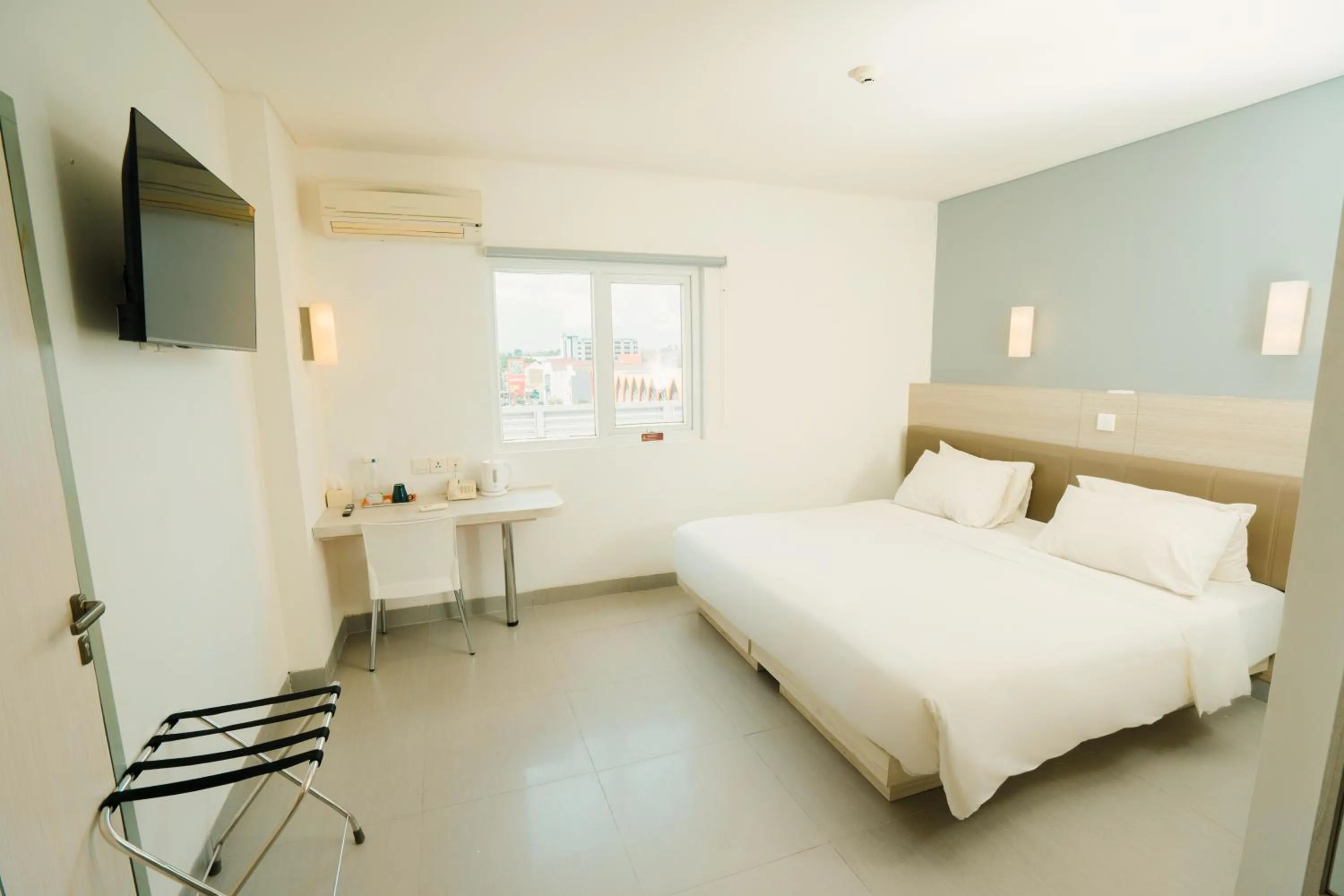 Photo of the whole room, Bed in Carani Hotel Yogyakarta