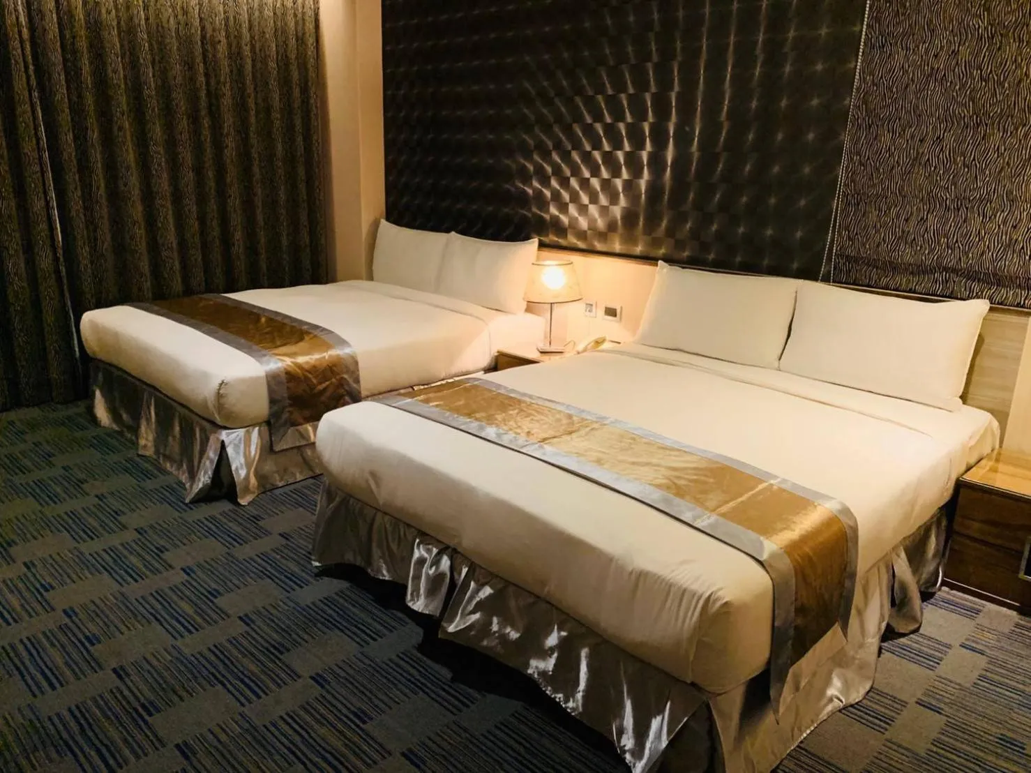 Bed in Kaishen Sinsu Hotel