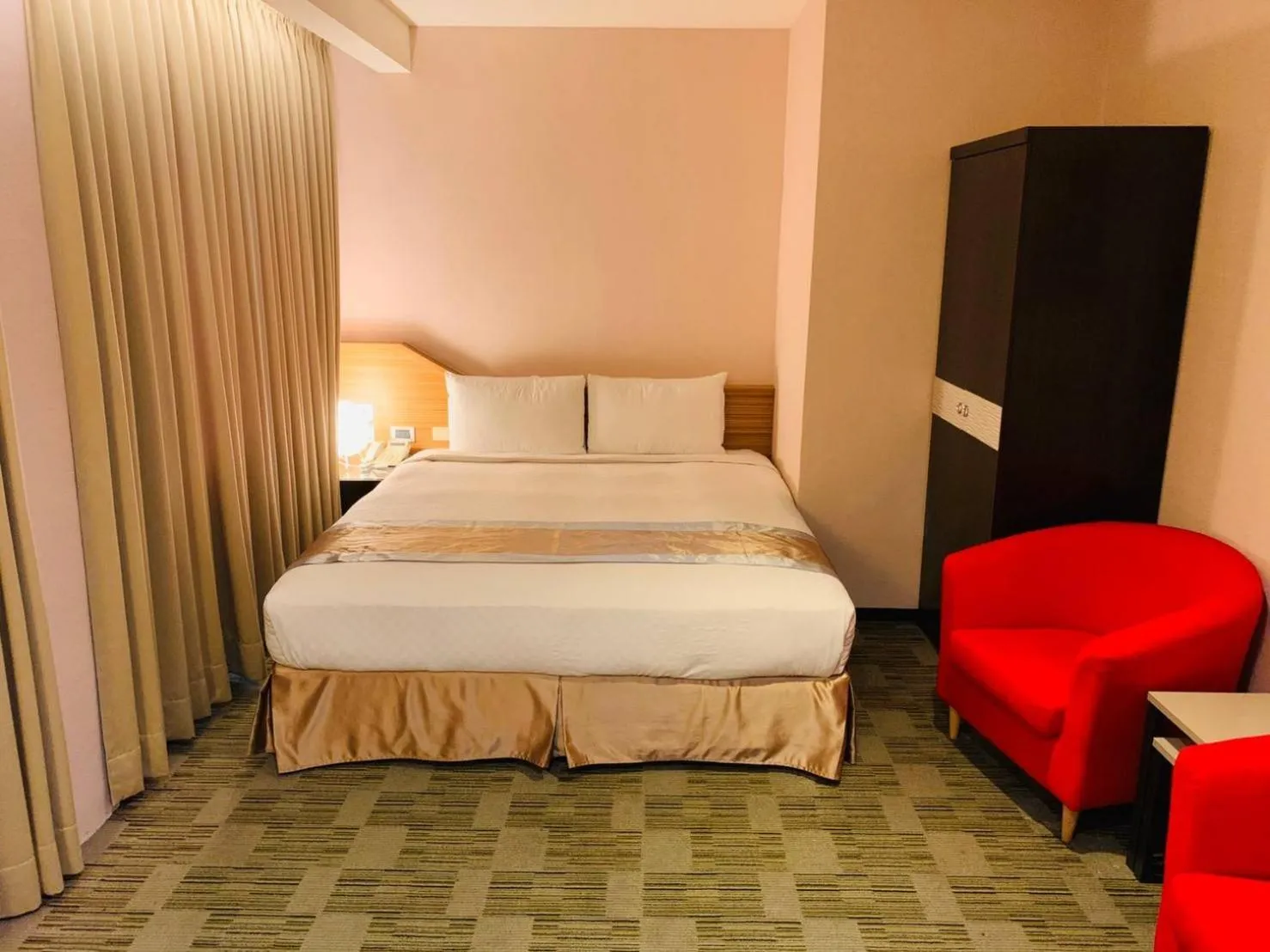 Bed in Kaishen Sinsu Hotel