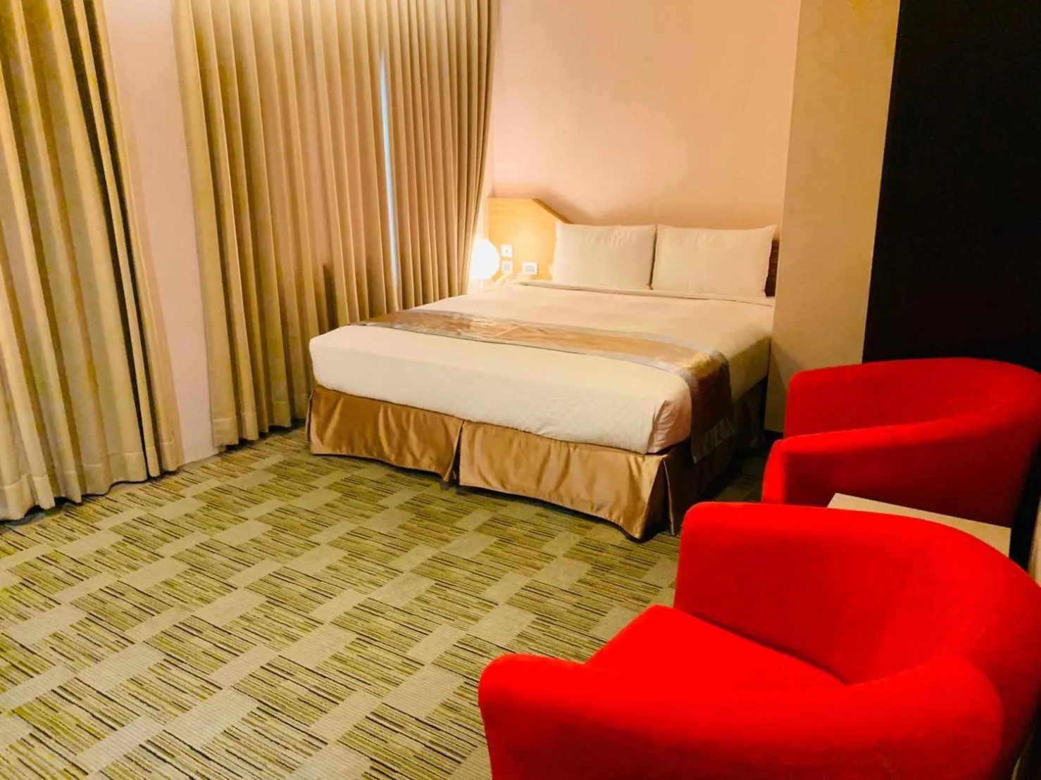 Bed in Kaishen Sinsu Hotel