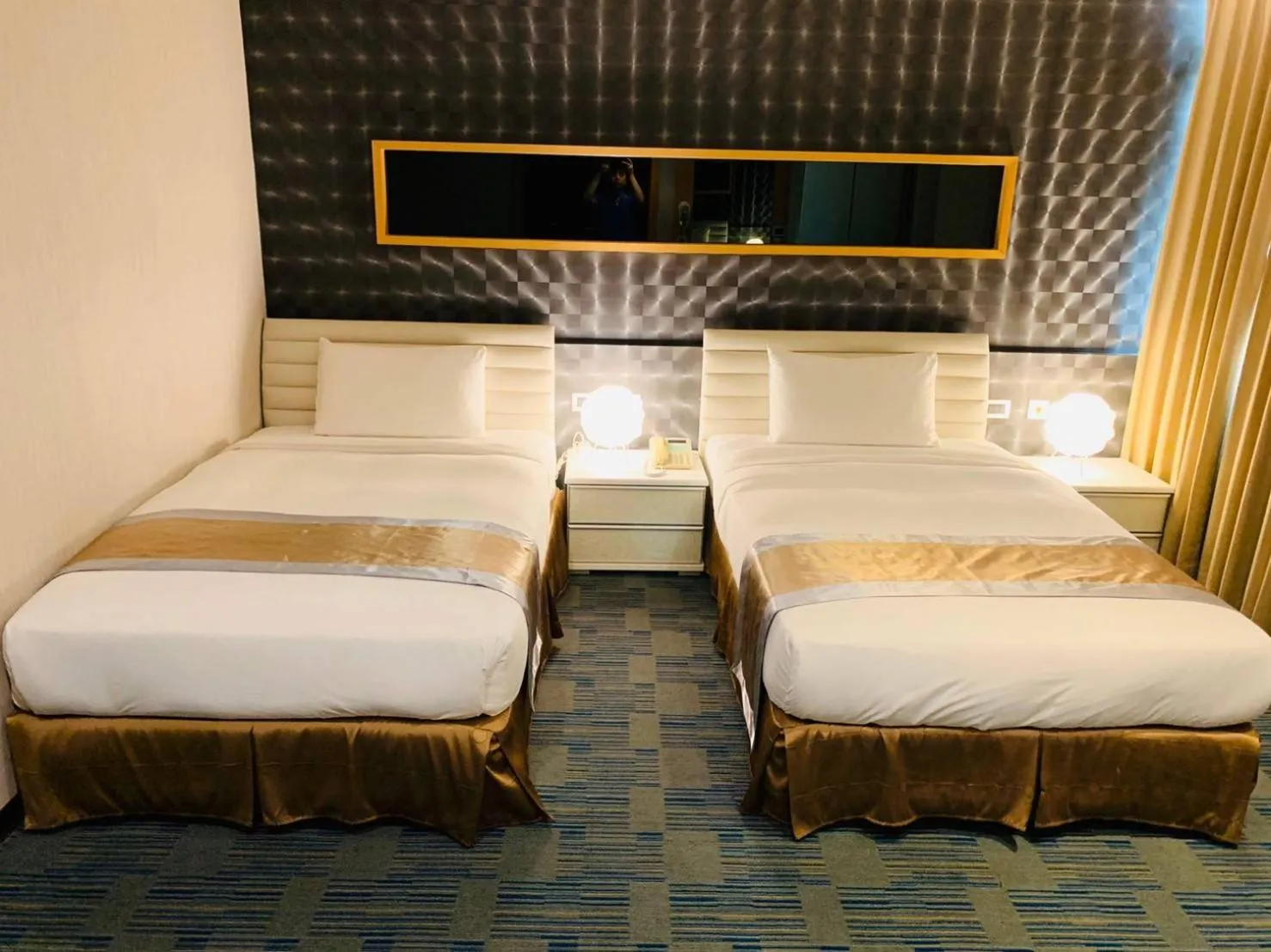 Bed in Kaishen Sinsu Hotel