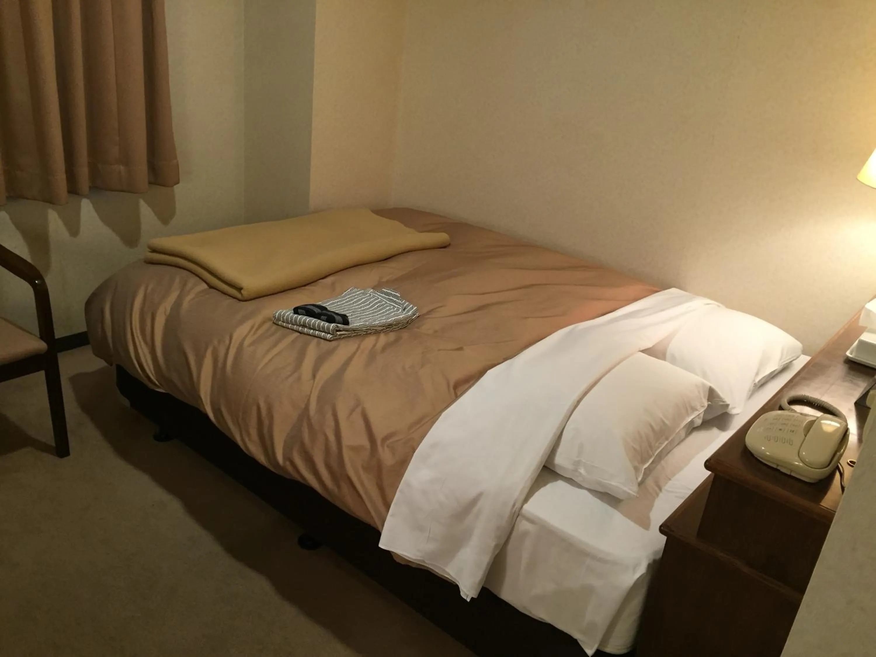 Photo of the whole room, Bed in Hotel Crown Hills Kitami