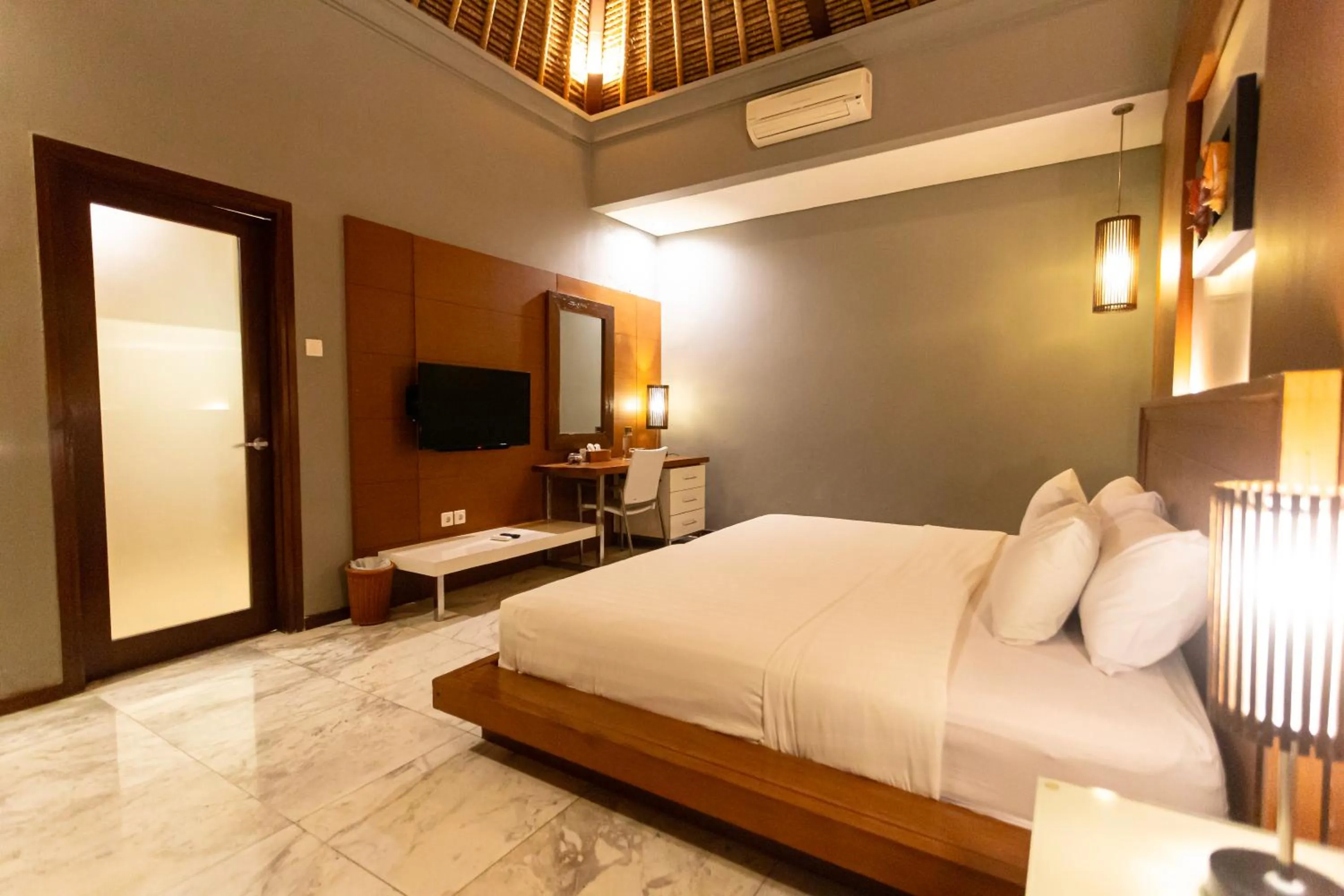 Bed in Abi Bali Resort and Villa