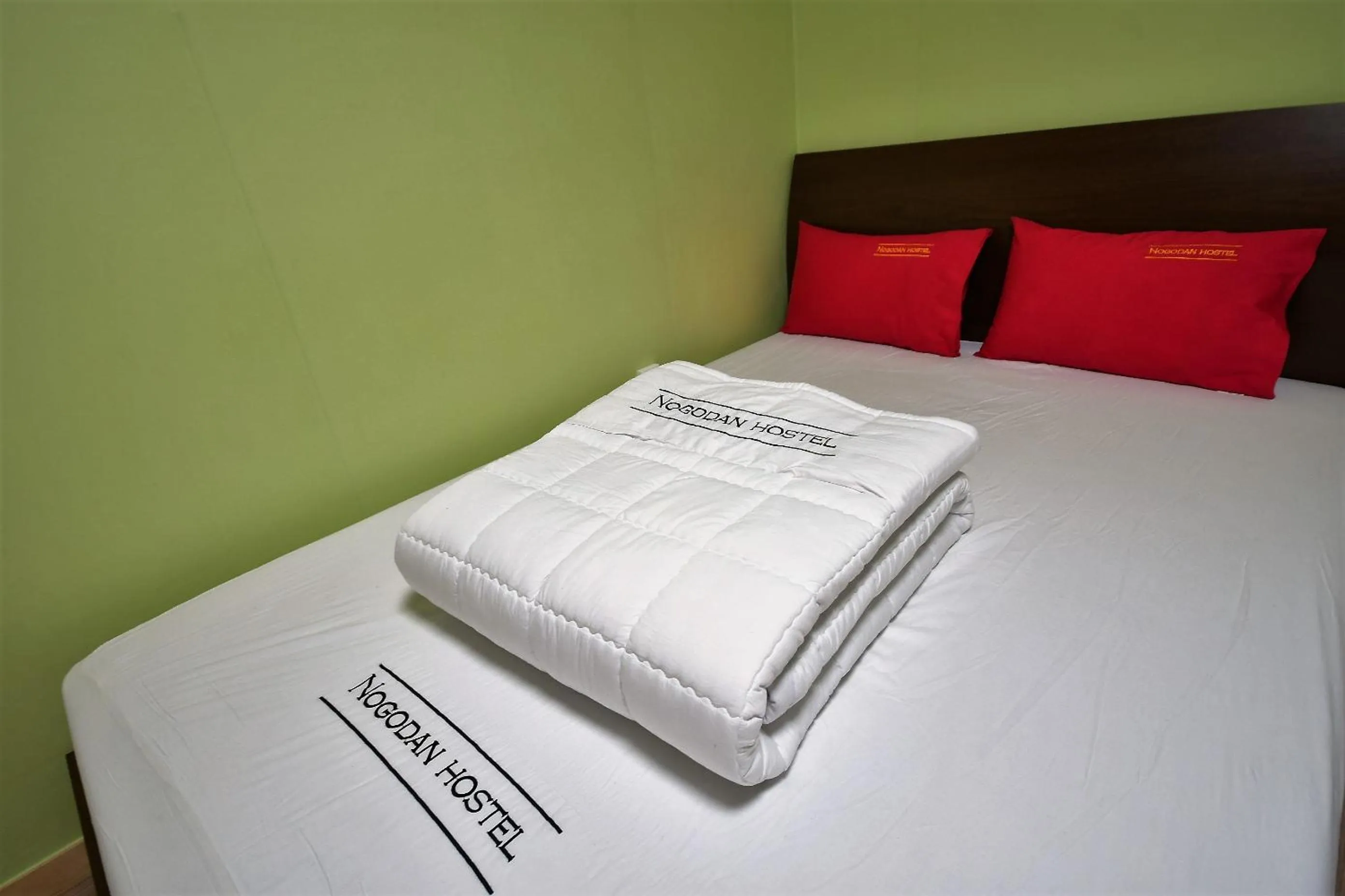 Bed in Nogodan Guesthouse and Hotel