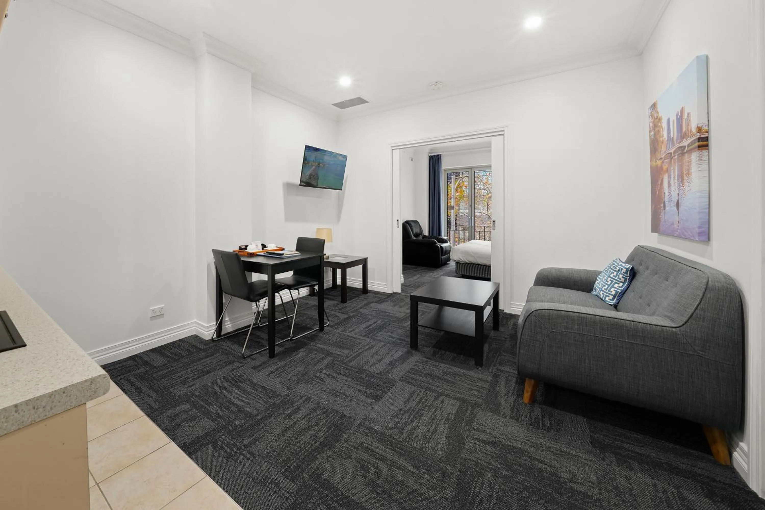 Living room, Bed in Comfort Apartments Melbourne Central