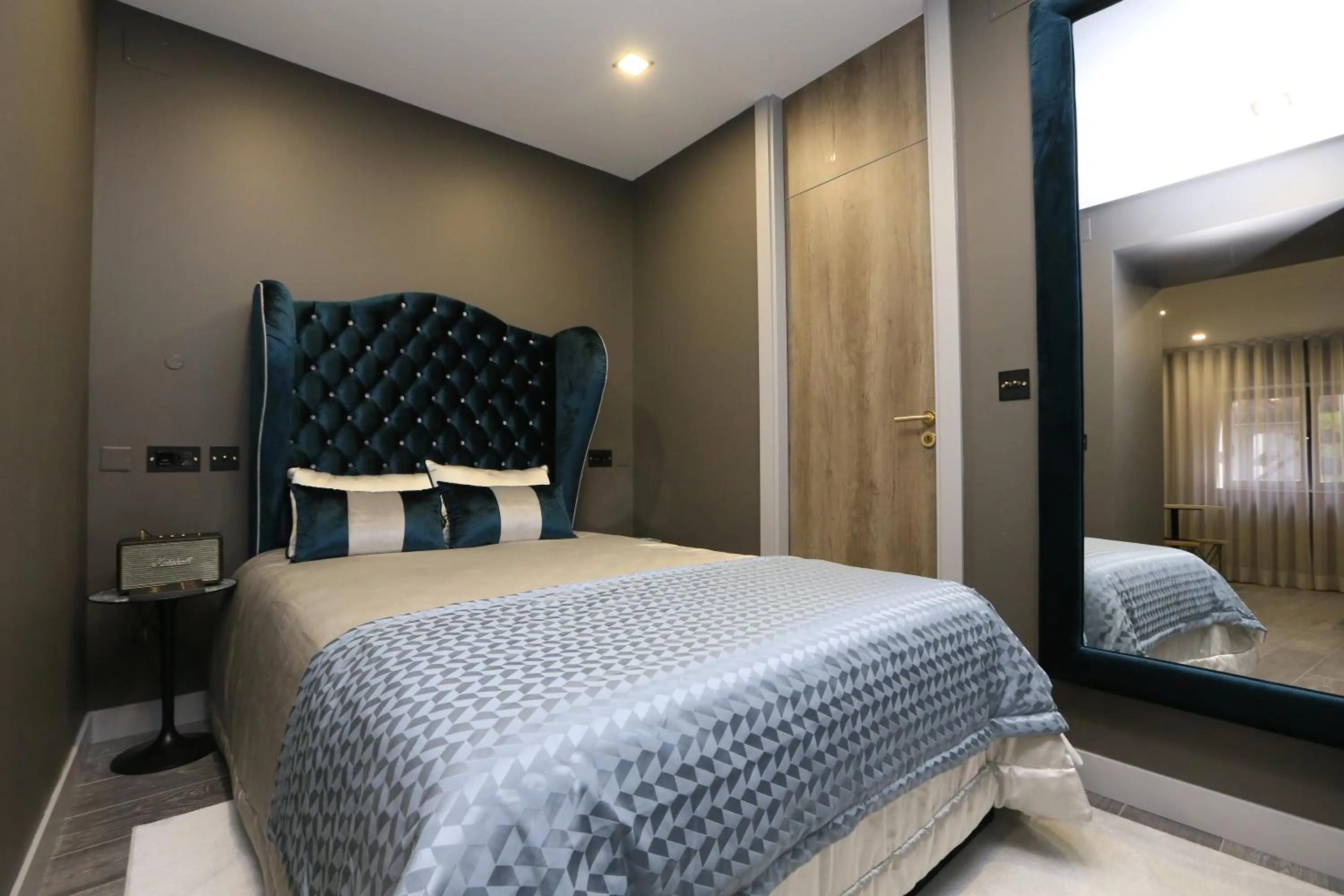 Photo of the whole room, Bed in Charm Flats