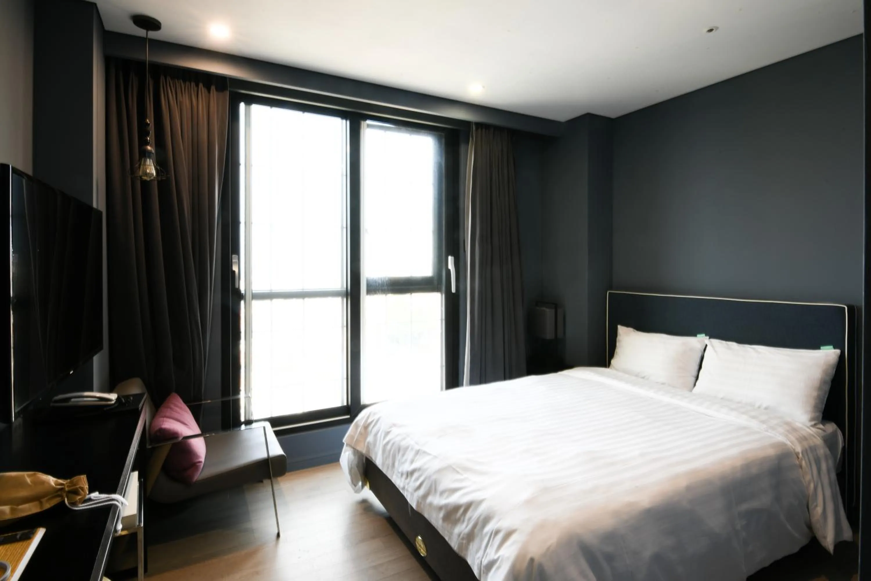 Bed in Urban Island Hotel Jeju