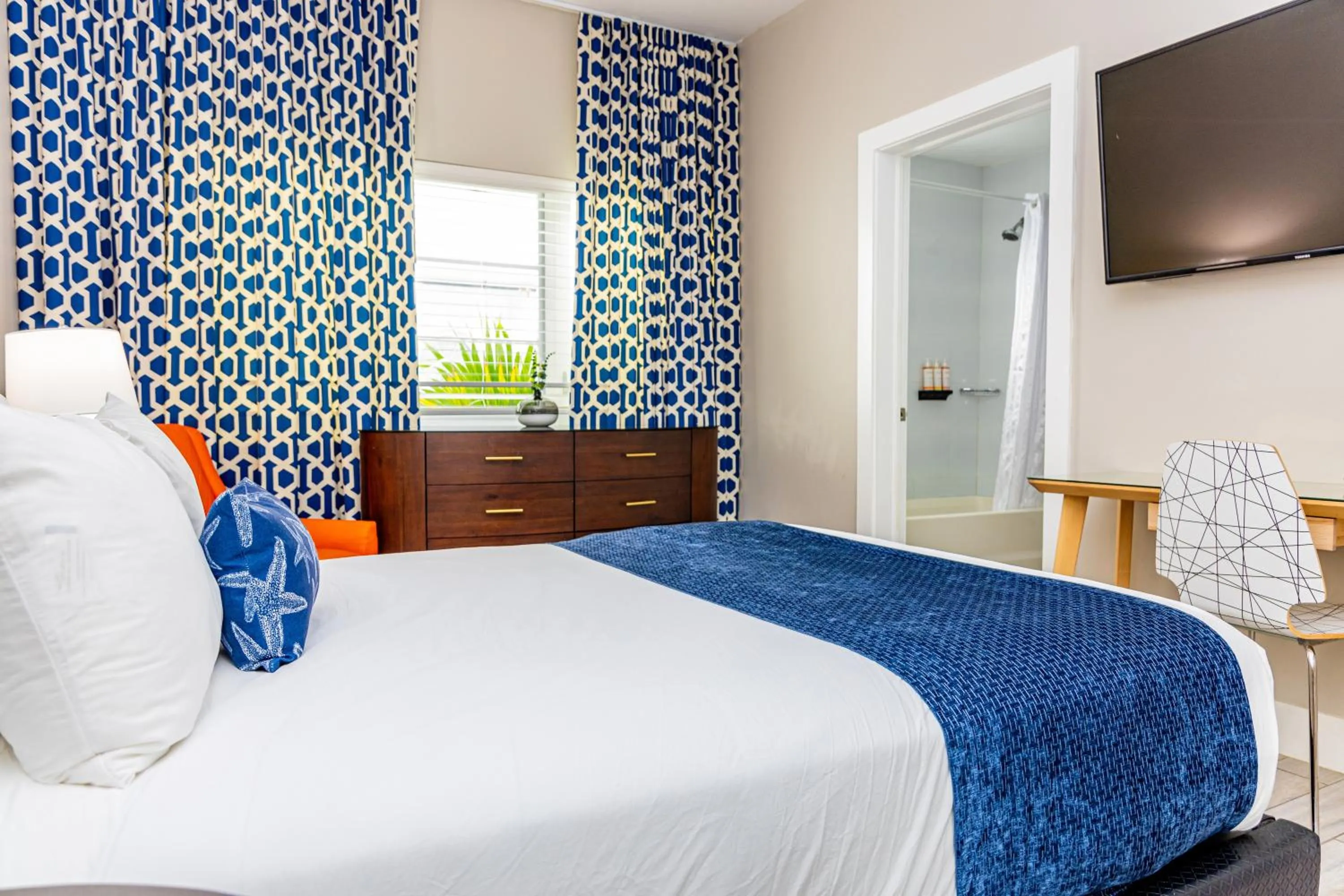 Bed in Oceanside Hotel and Suites