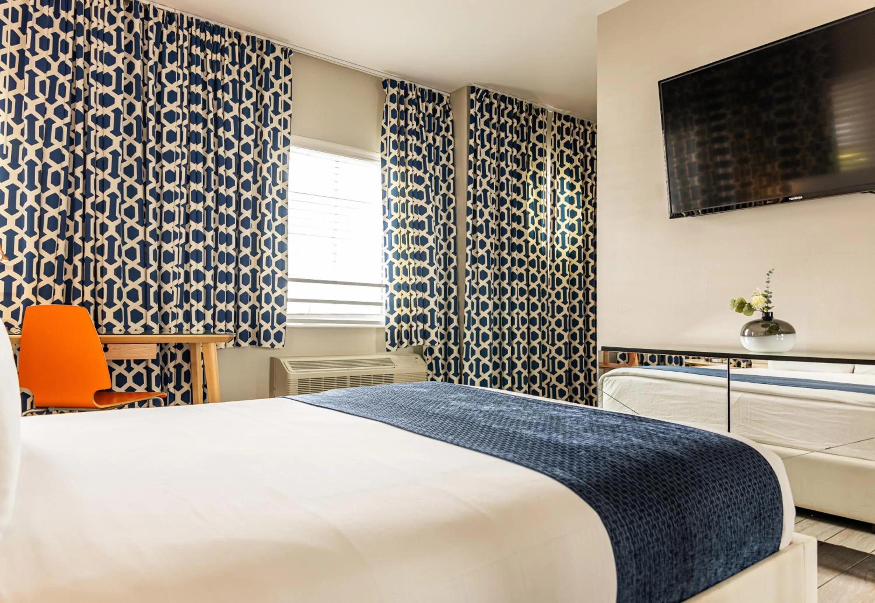 Bed in Oceanside Hotel and Suites