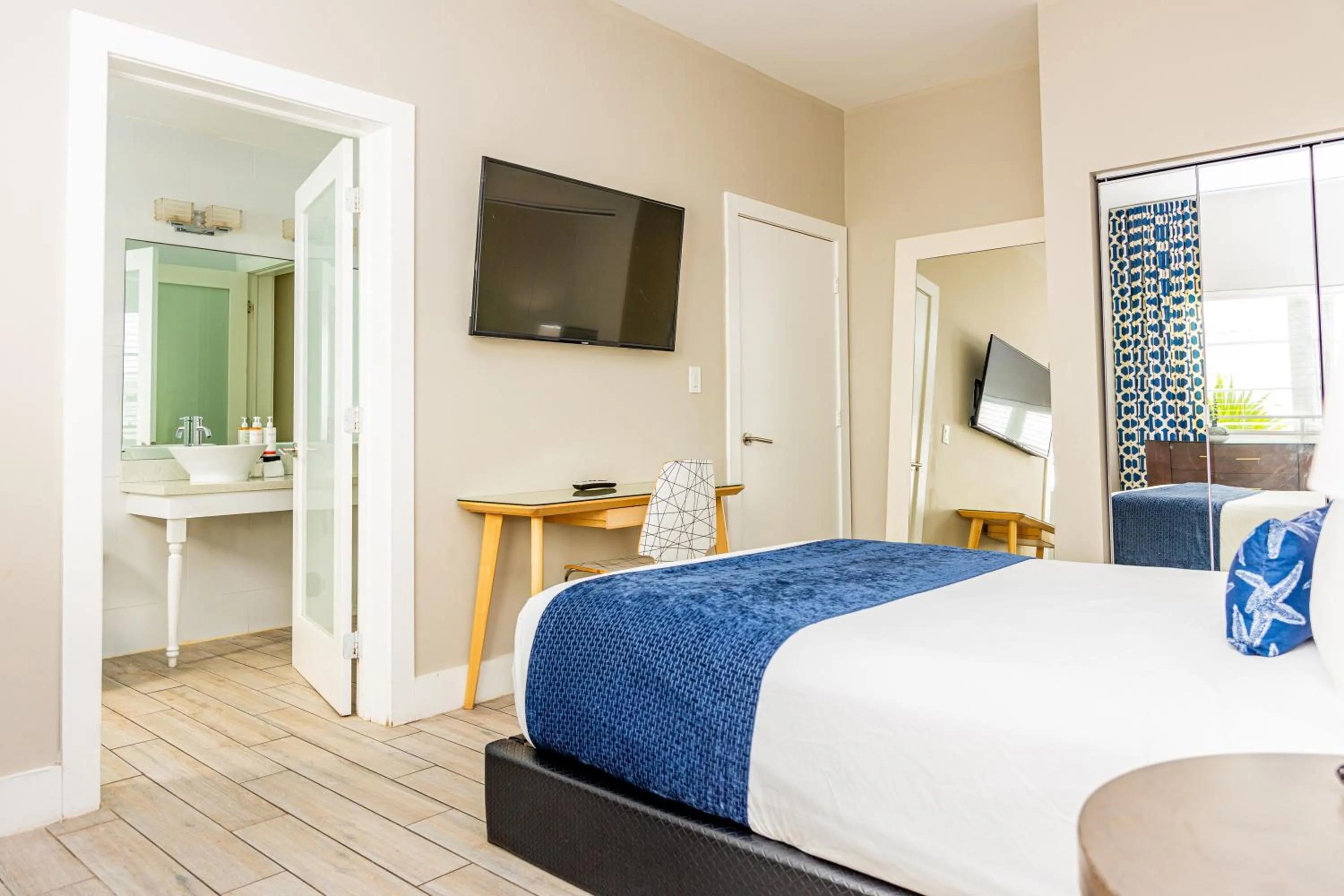 Bed in Oceanside Hotel and Suites