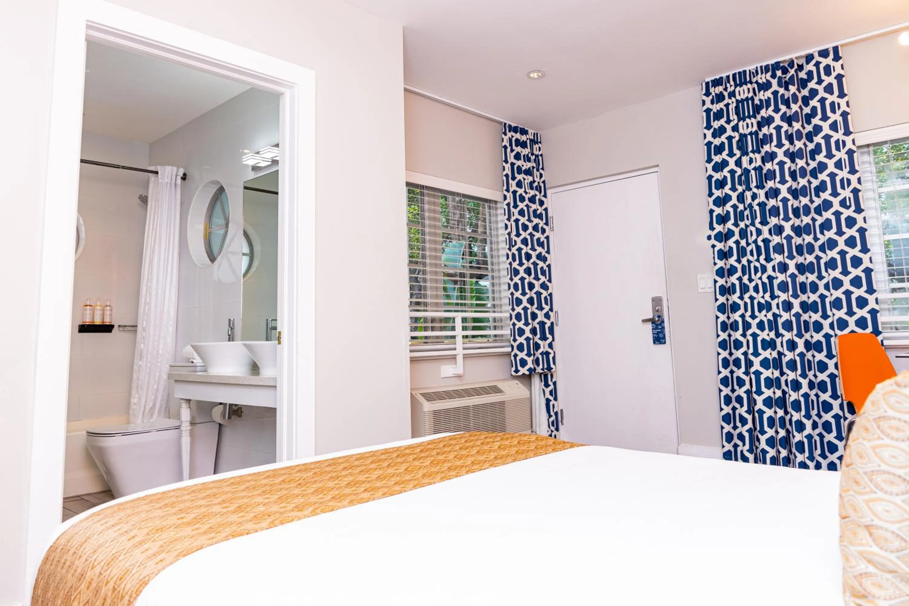 Bed in Oceanside Hotel and Suites