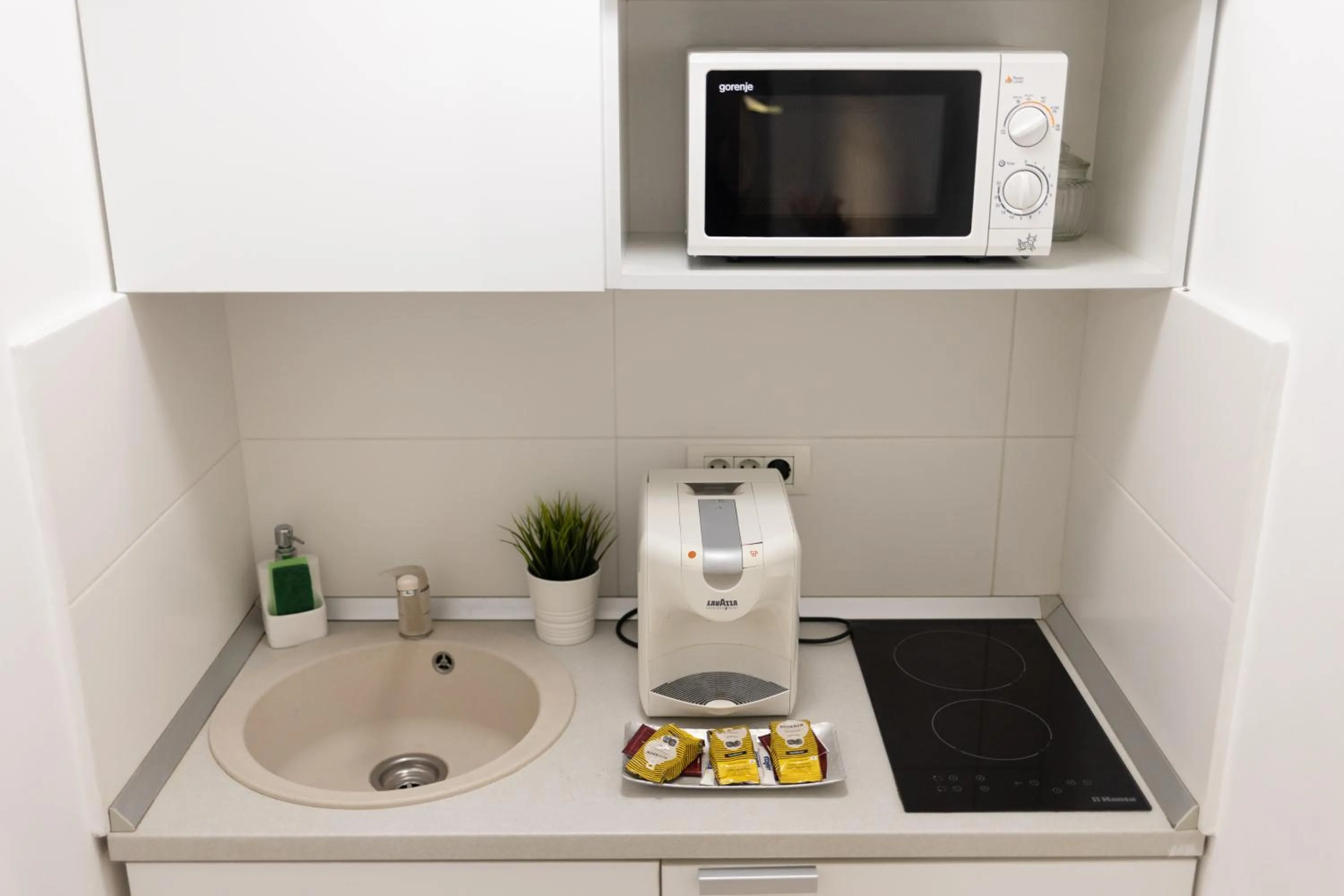 Kitchen or kitchenette in Metropole Apartments - Old City