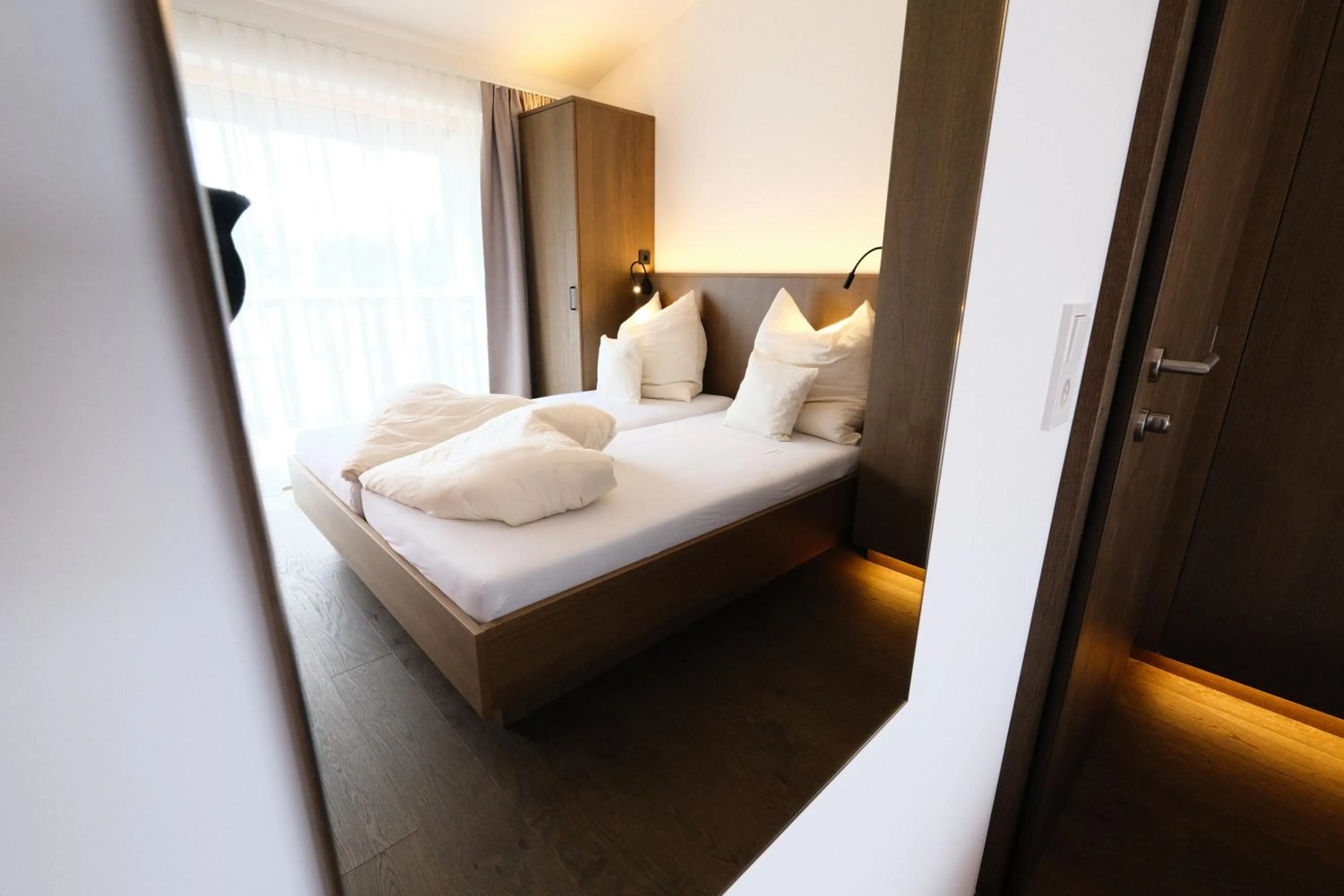 Bedroom, Bed in SeeHotel & SeeApartments Kärntnerhof- direkt am See!