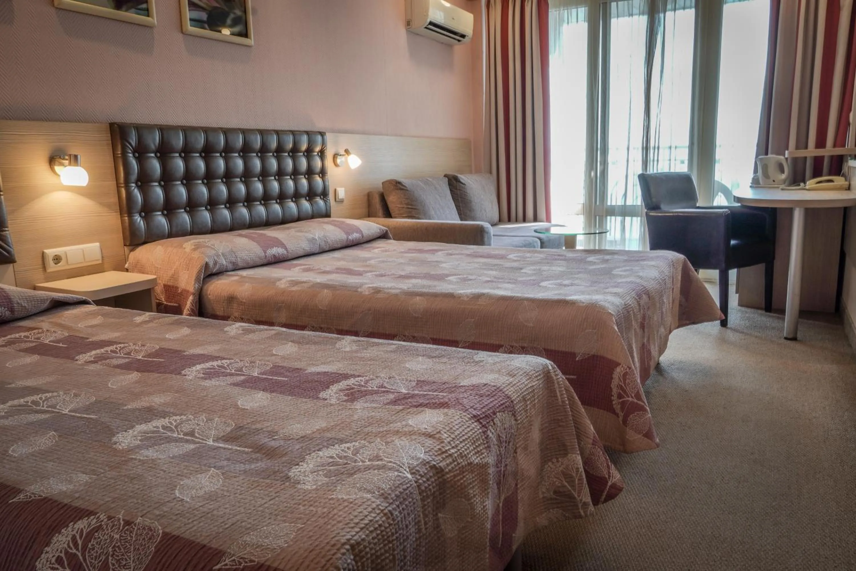 Bed in Hotel Sandy Beach