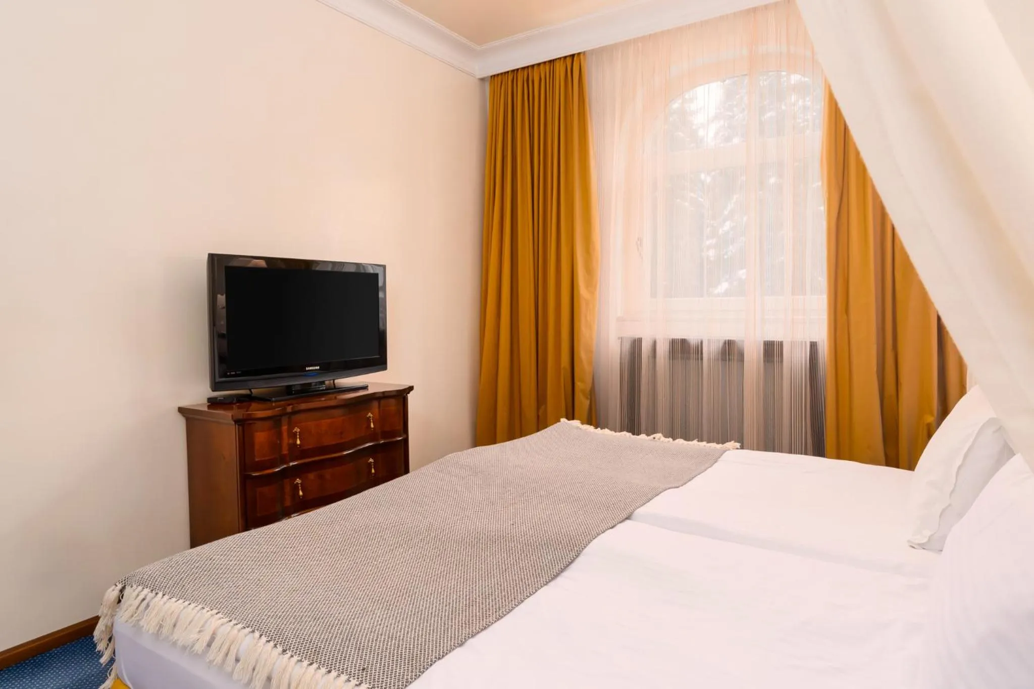 Bed in Festa Winter Palace Hotel