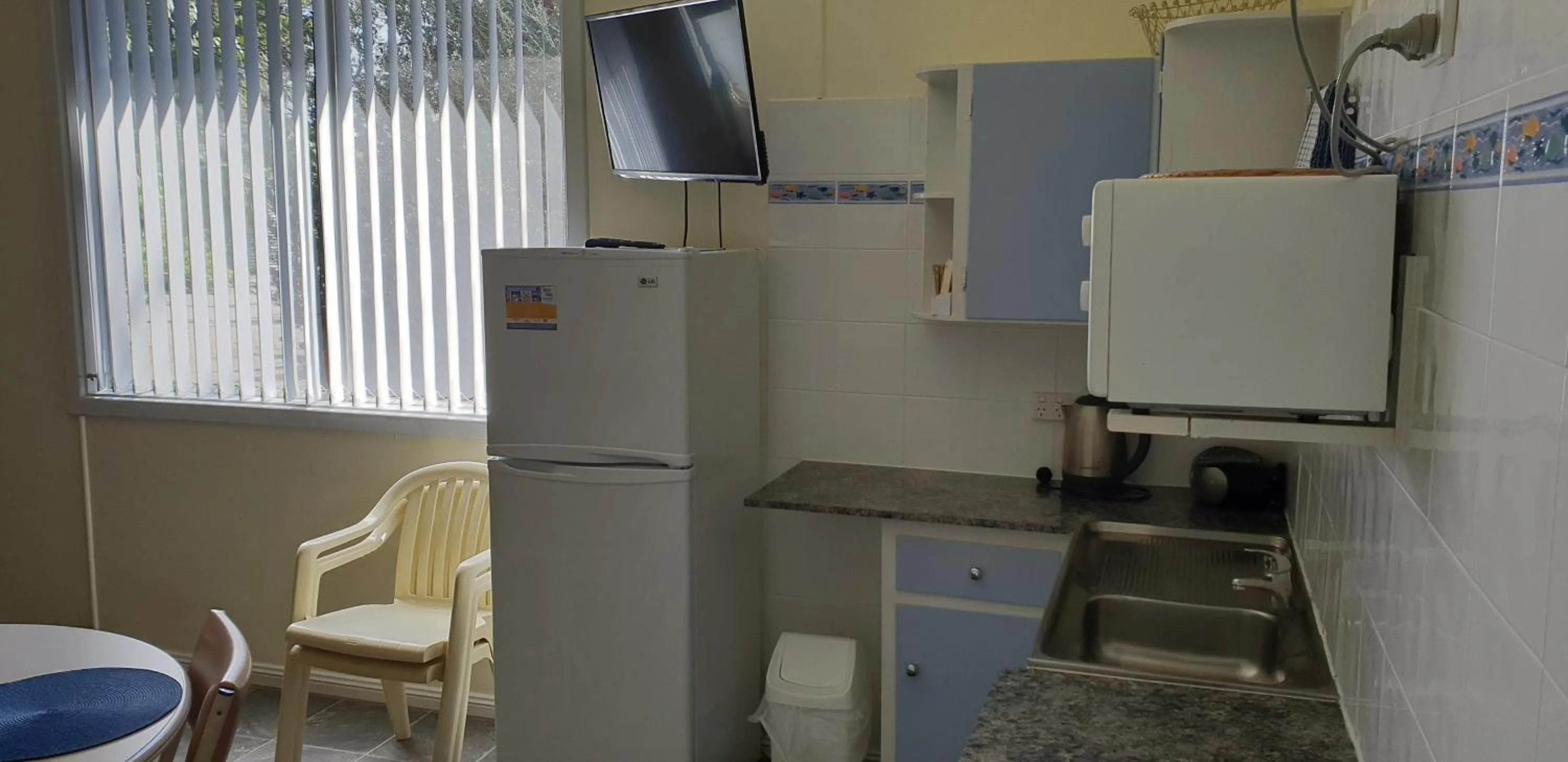 Kitchen or kitchenette in Modra's Apartments