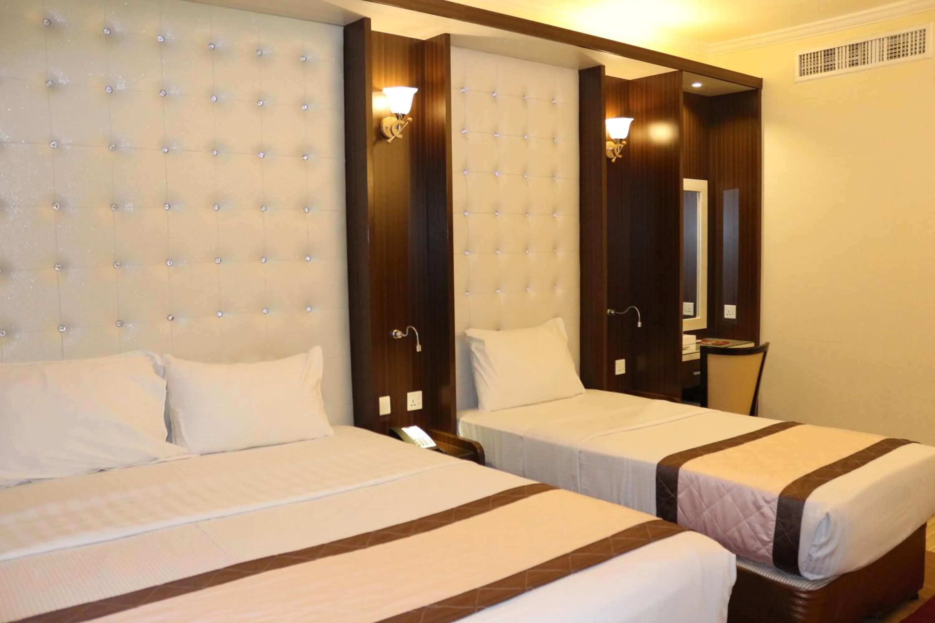 Bed in Al Khaleej Grand Hotel