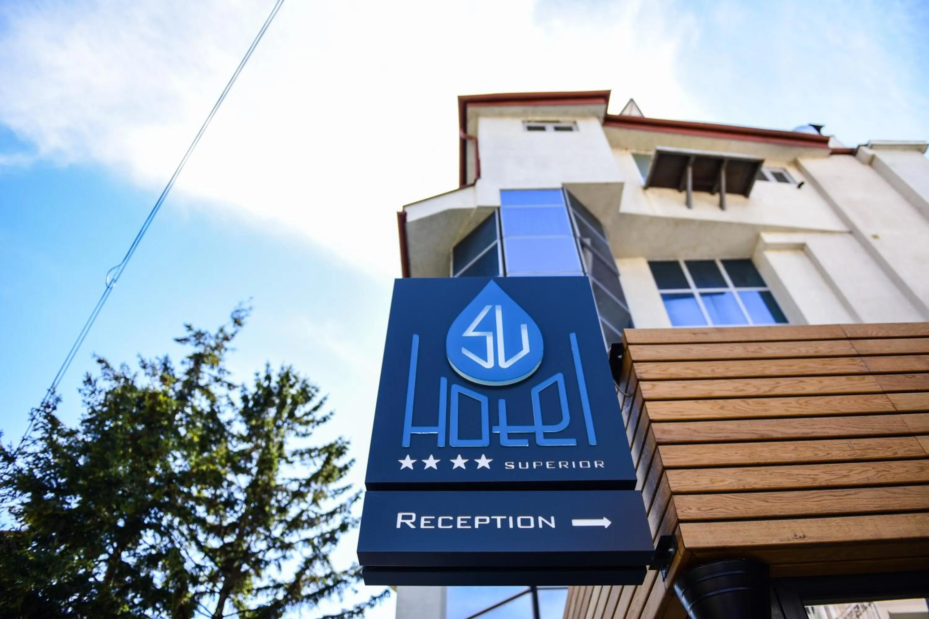 Property logo or sign in SU Hotel