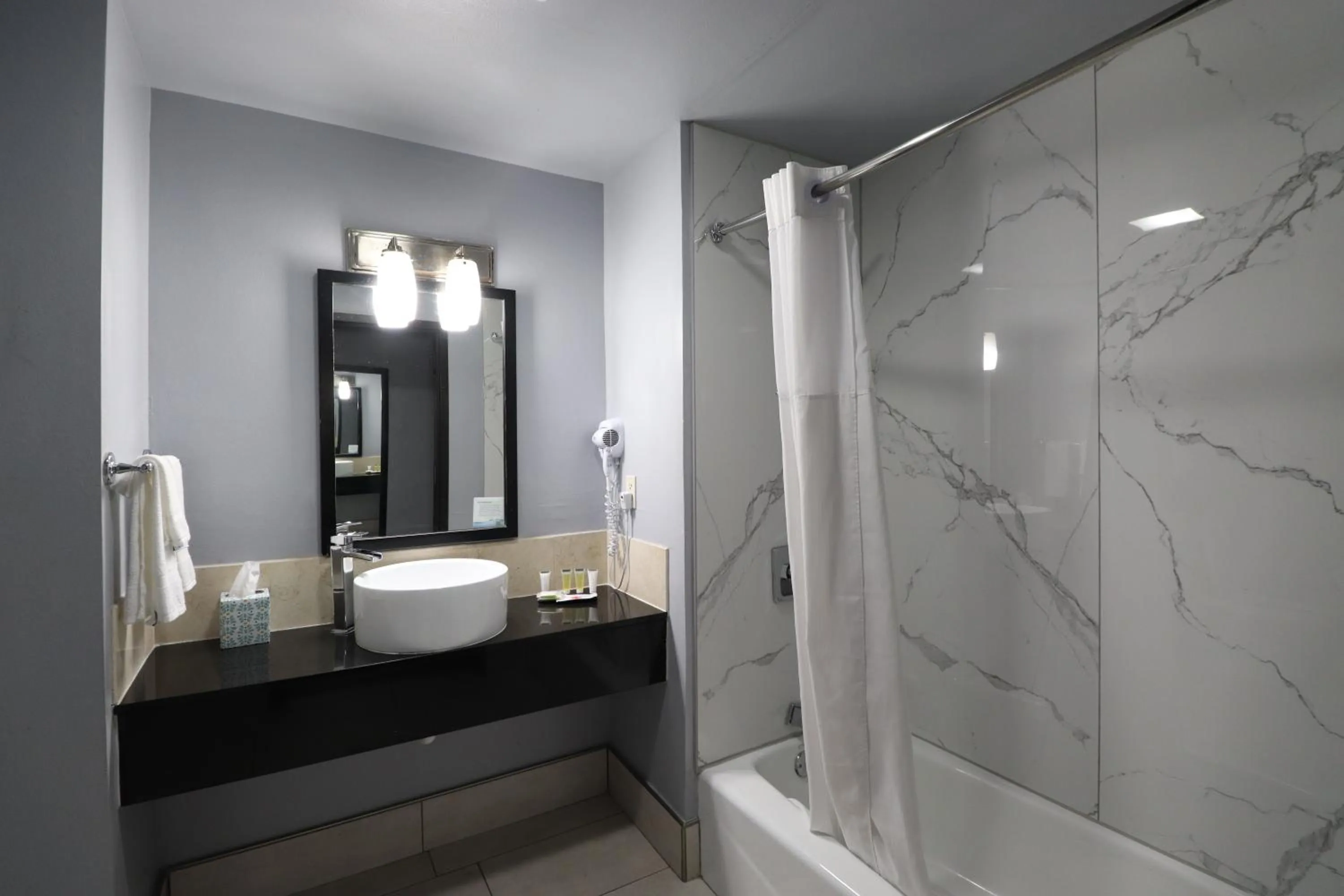 Bathroom in Days Inn & Suites by Wyndham Milwaukee