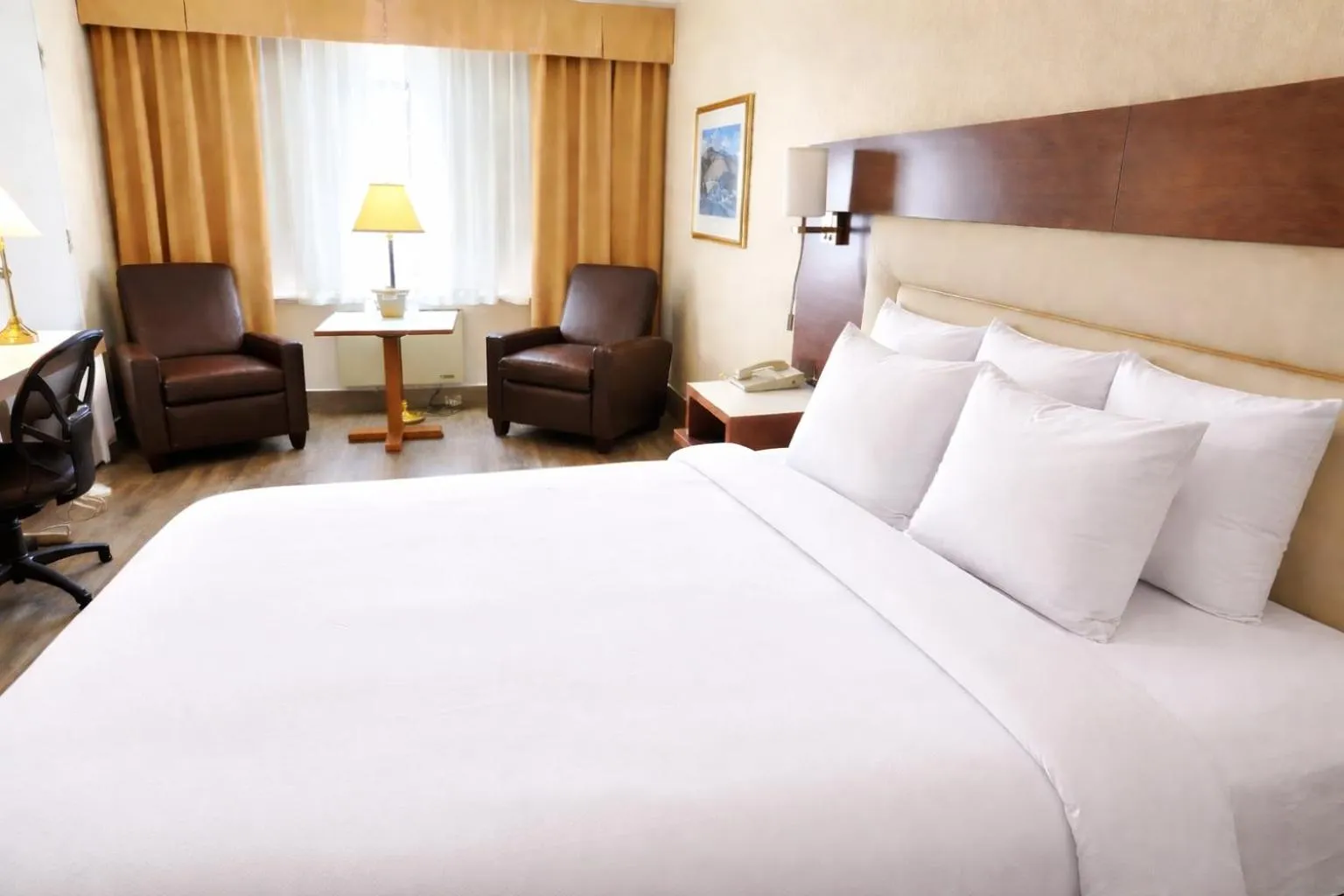 Bed in Quality Inn & Suites